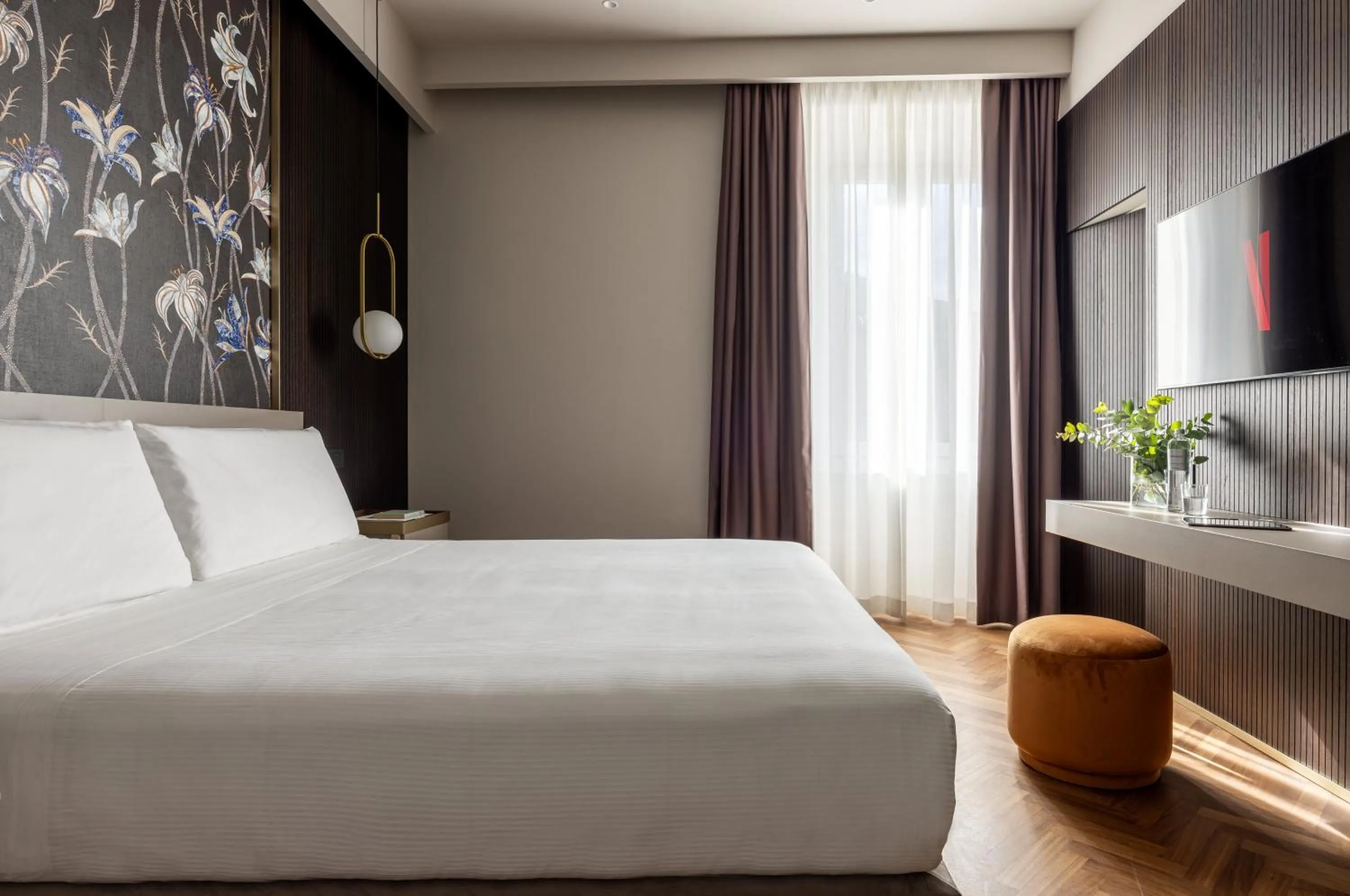 Bed in Aramis Deluxe Rooms