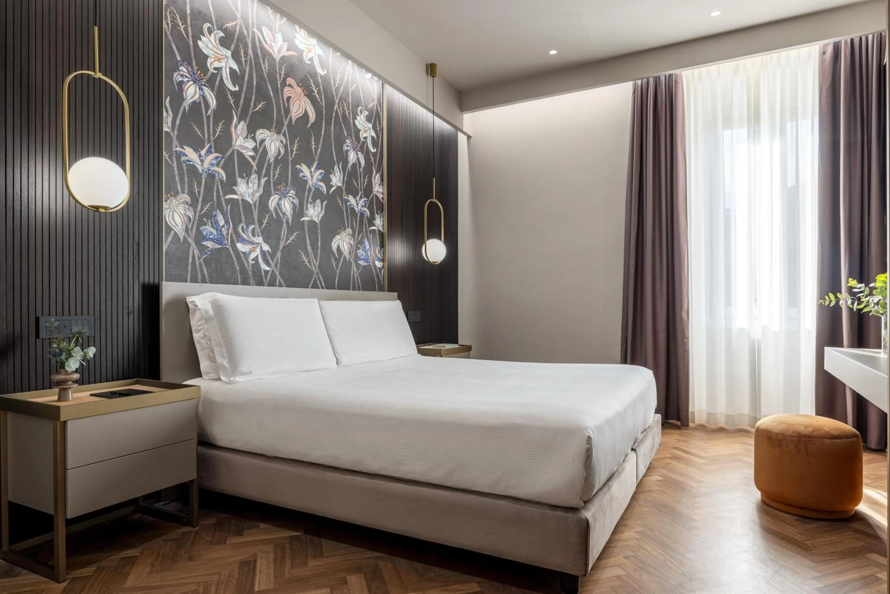 Bed in Aramis Deluxe Rooms