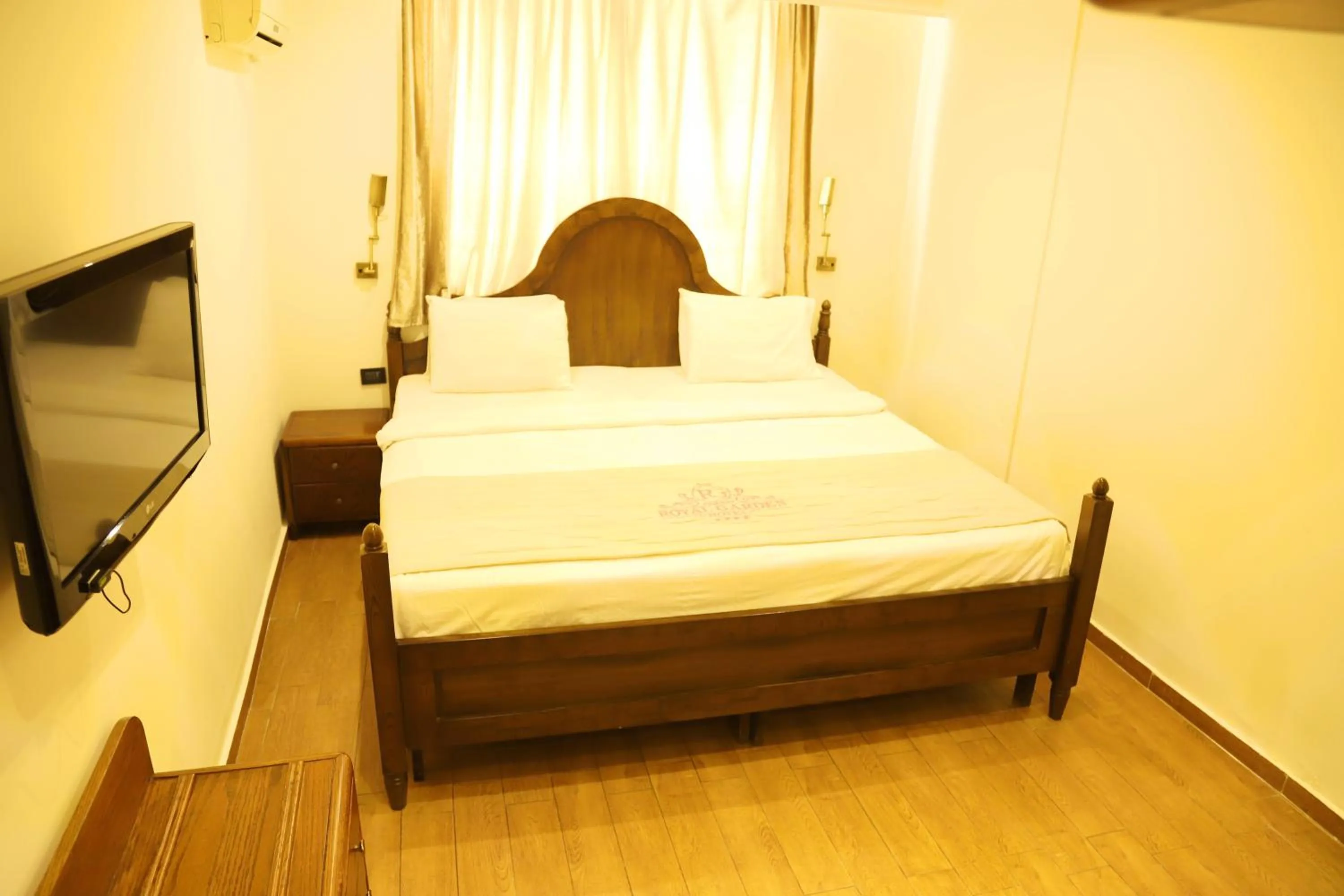 Bed in Royal Garden Hotel