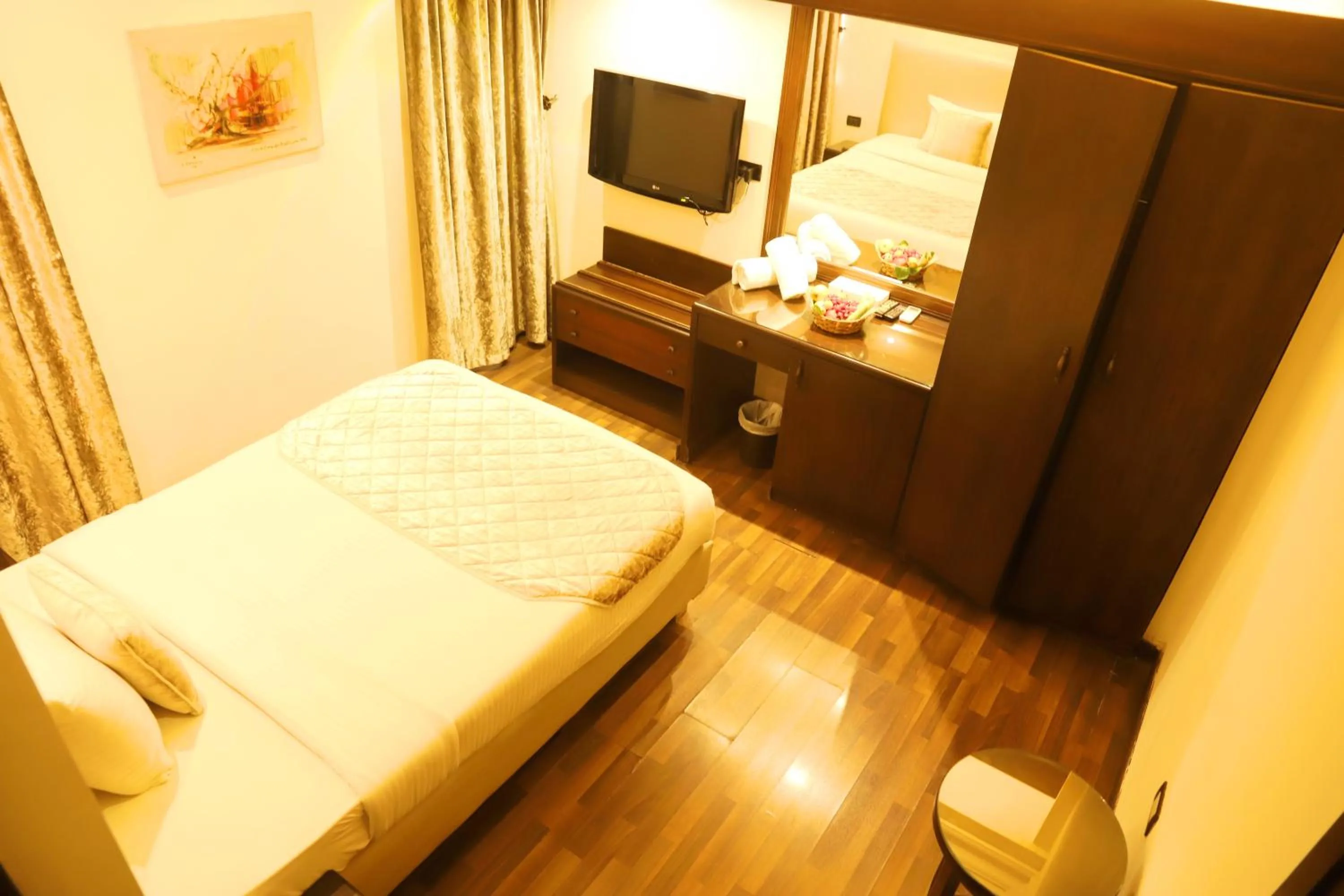 Bed in Royal Garden Hotel