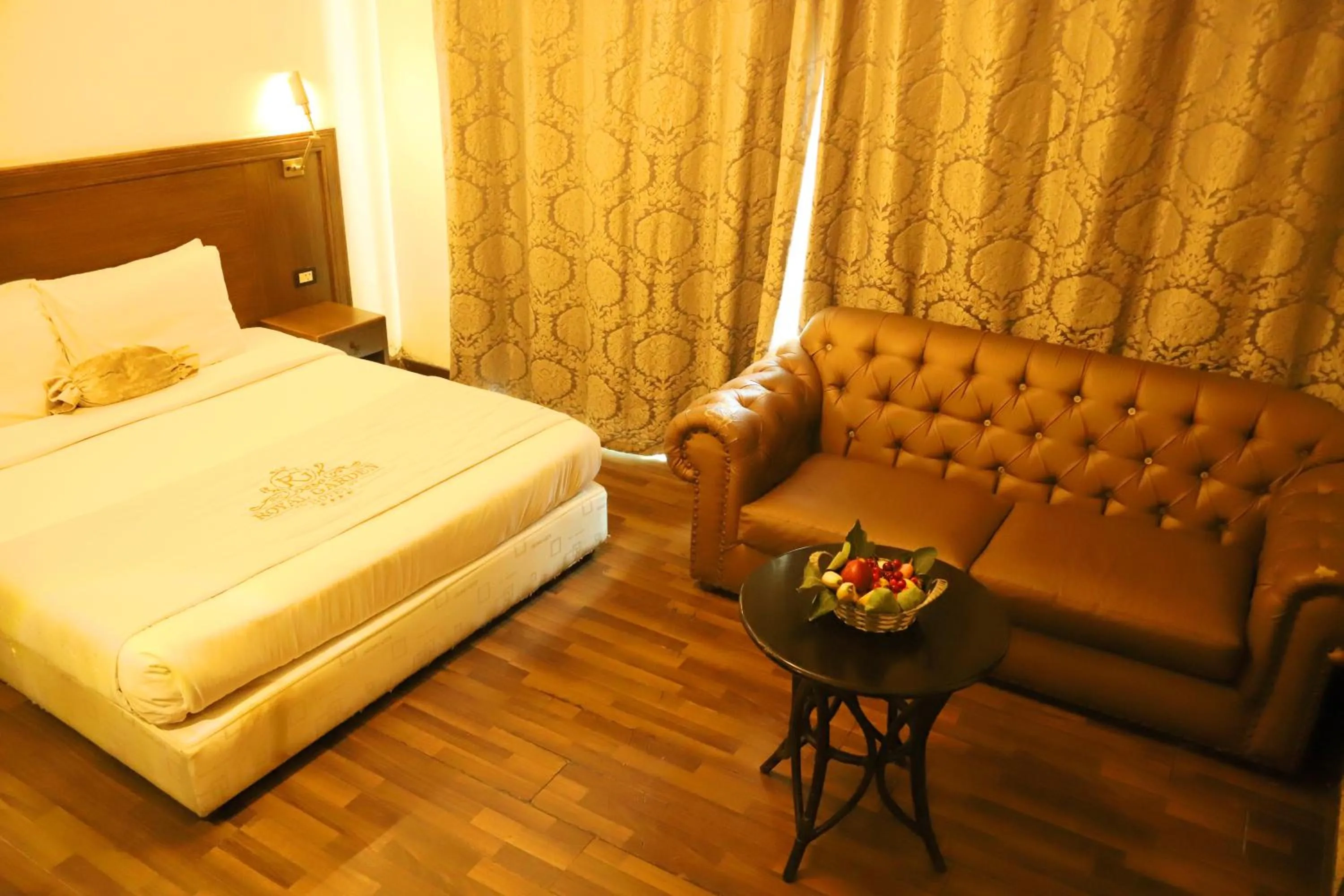Bed in Royal Garden Hotel