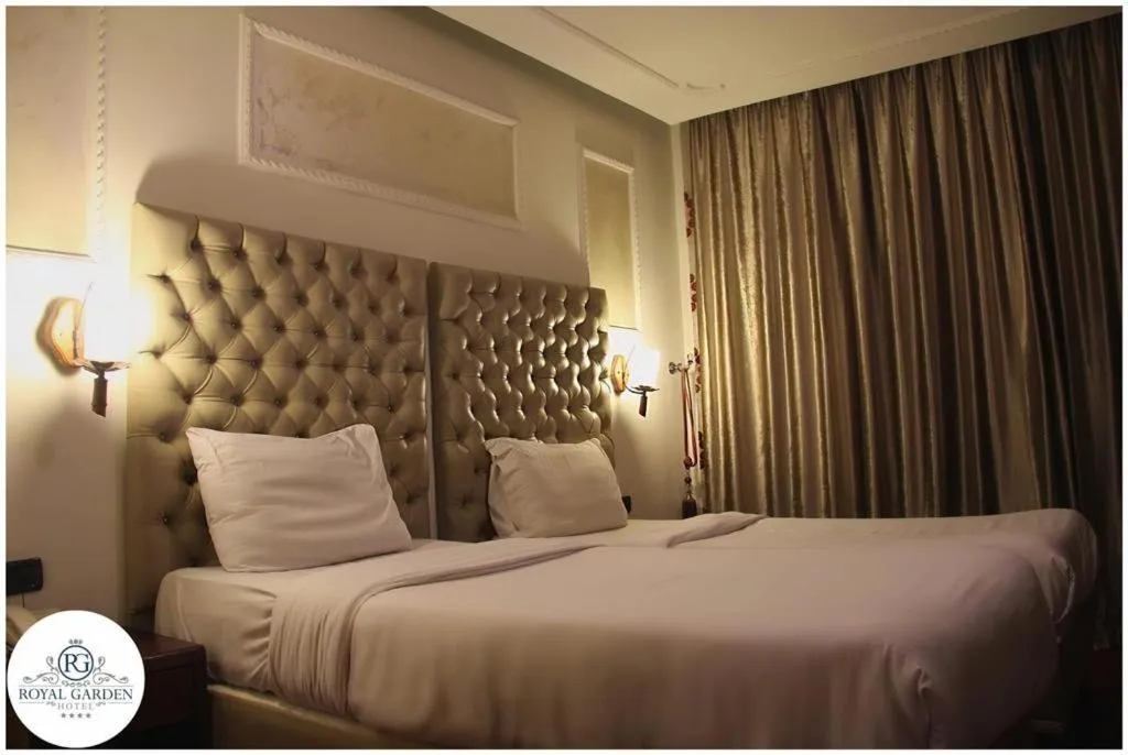 Bed in Royal Garden Hotel