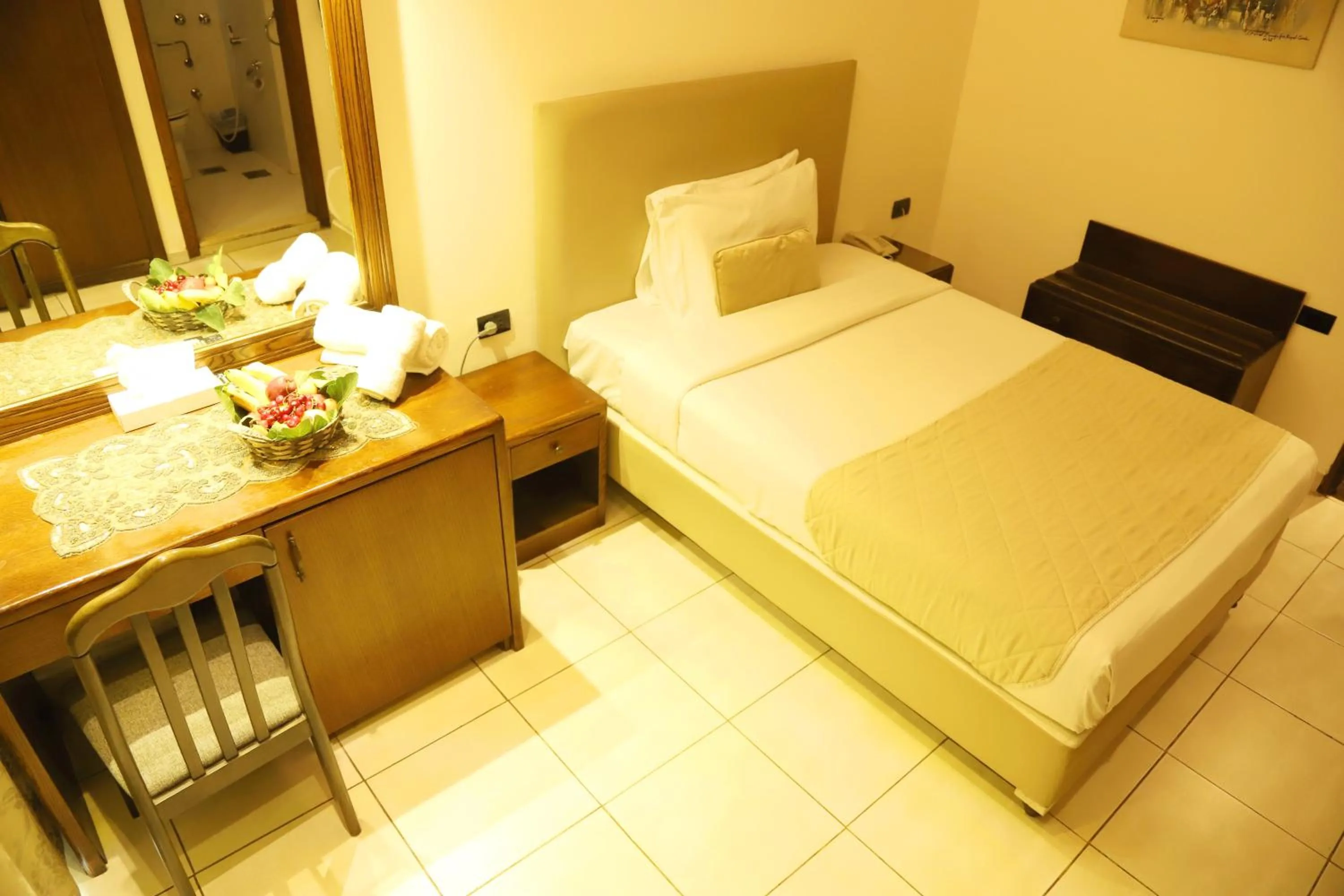 Bed in Royal Garden Hotel