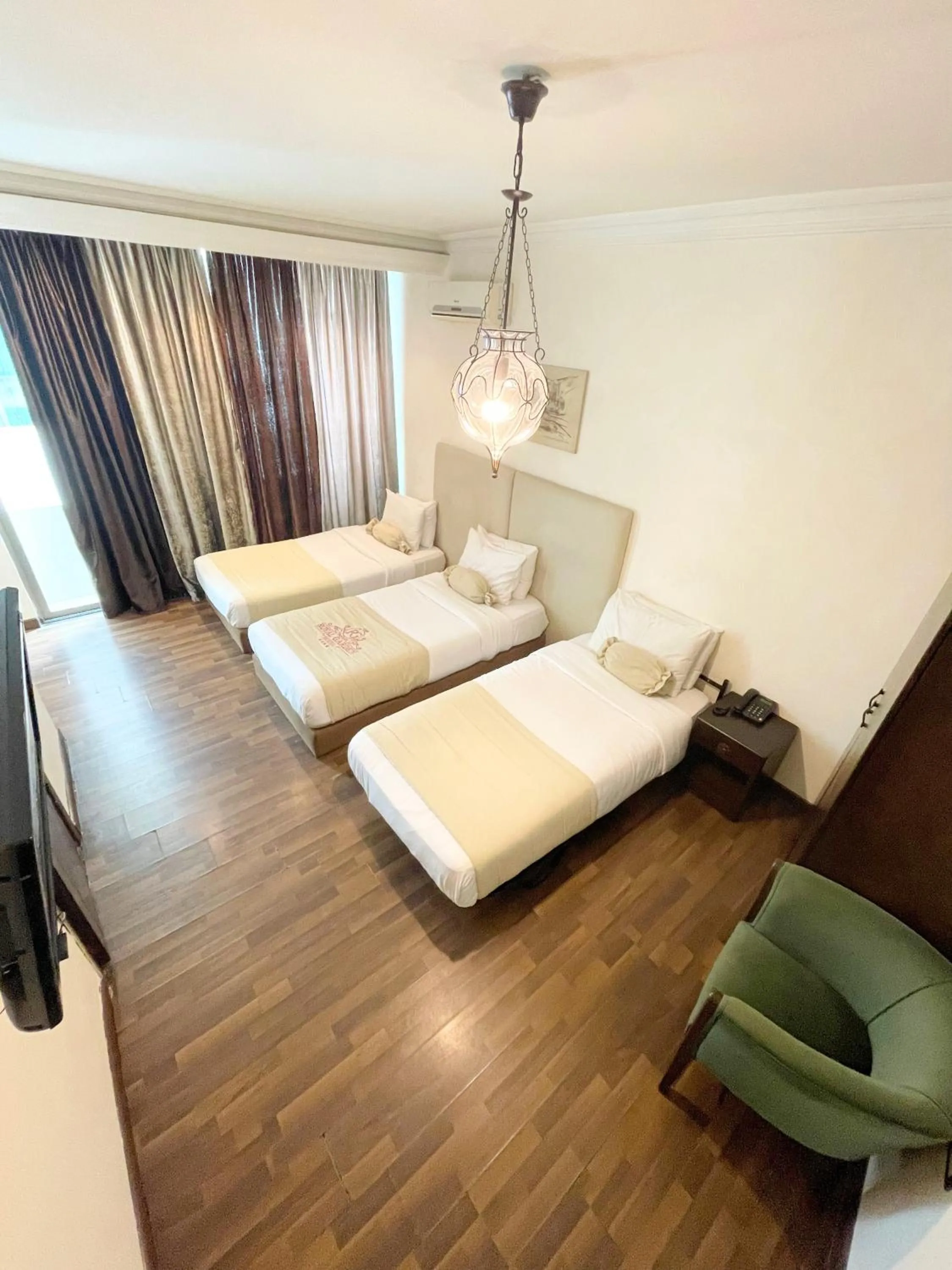 Bed in Royal Garden Hotel