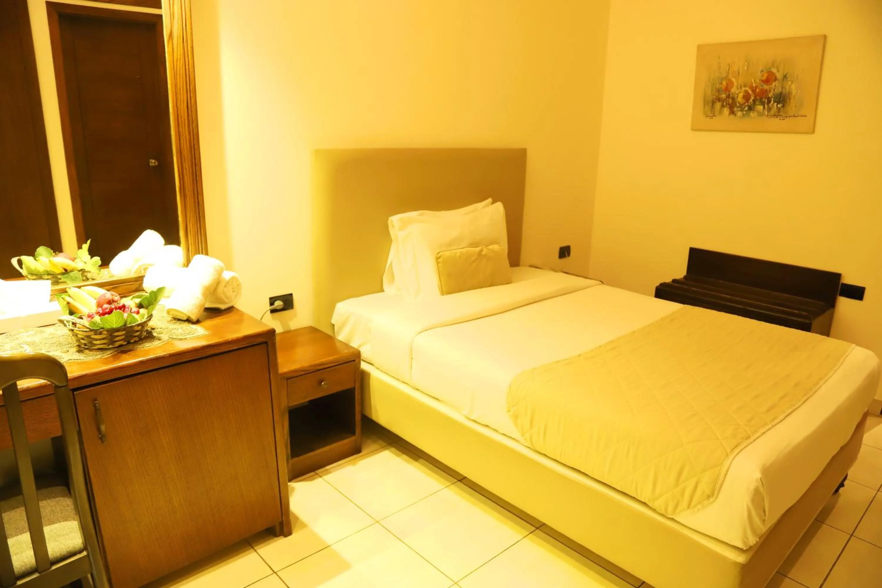 Bed in Royal Garden Hotel