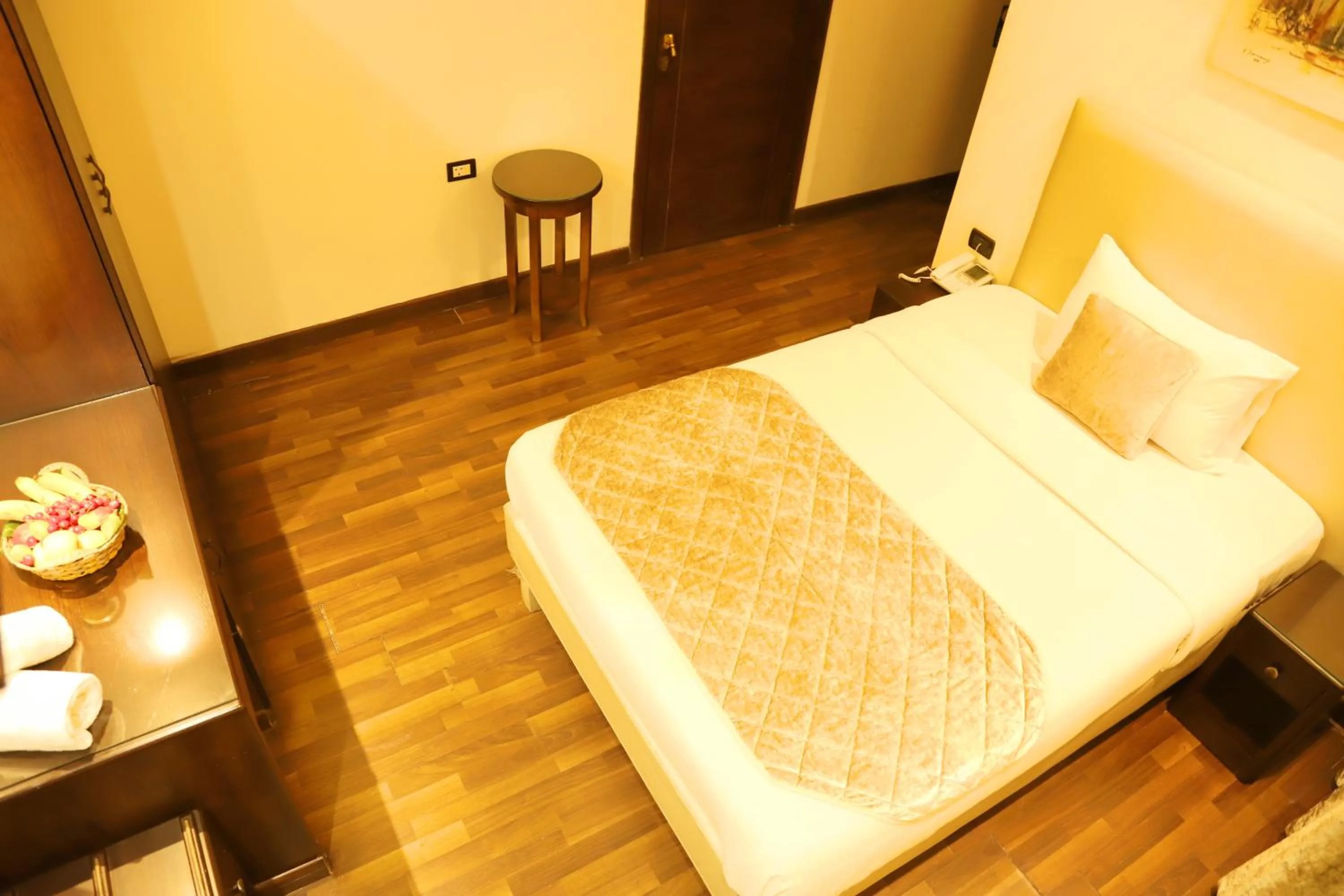 Bed in Royal Garden Hotel