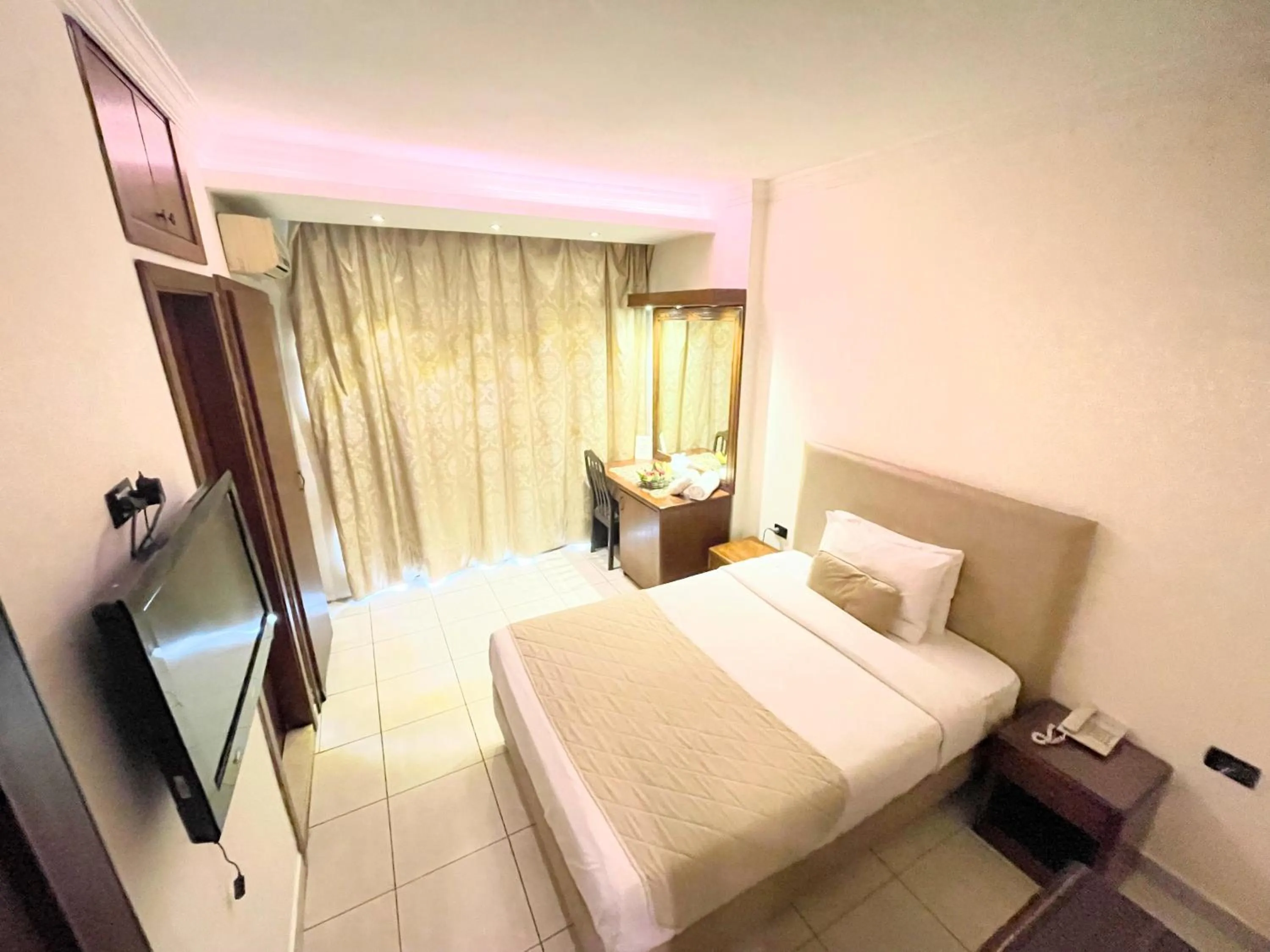 Bed in Royal Garden Hotel