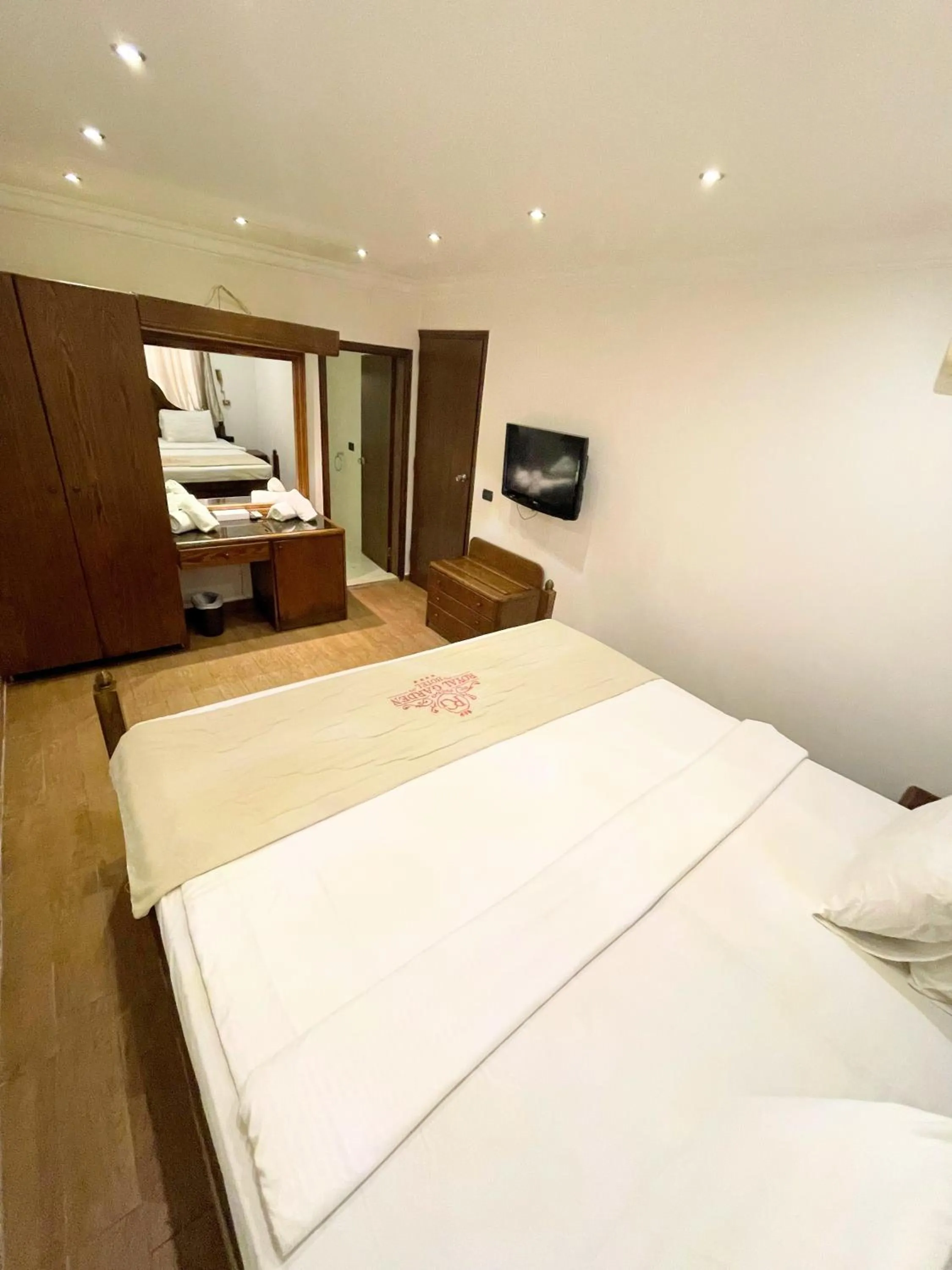 Bed in Royal Garden Hotel