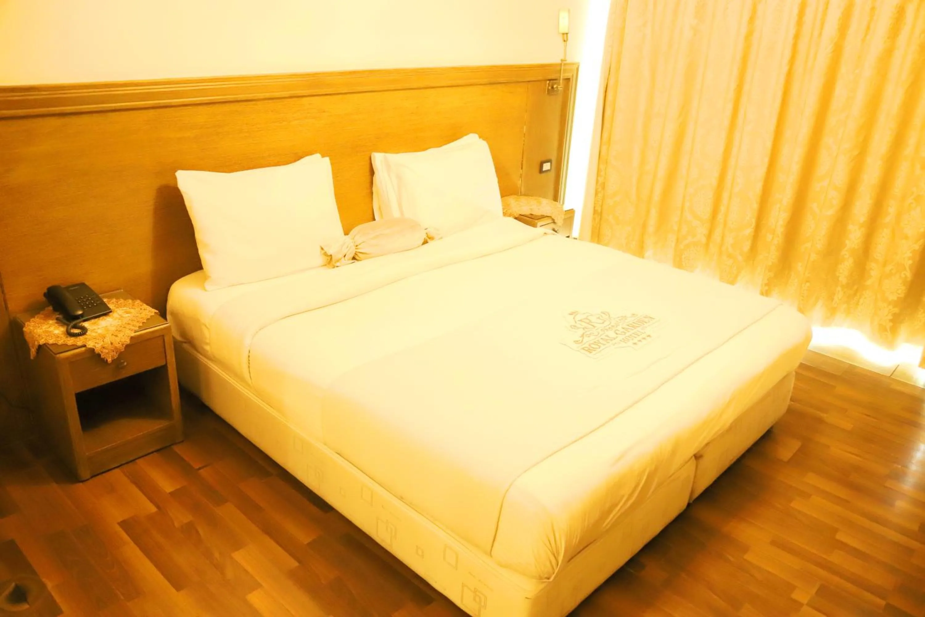 Bed in Royal Garden Hotel