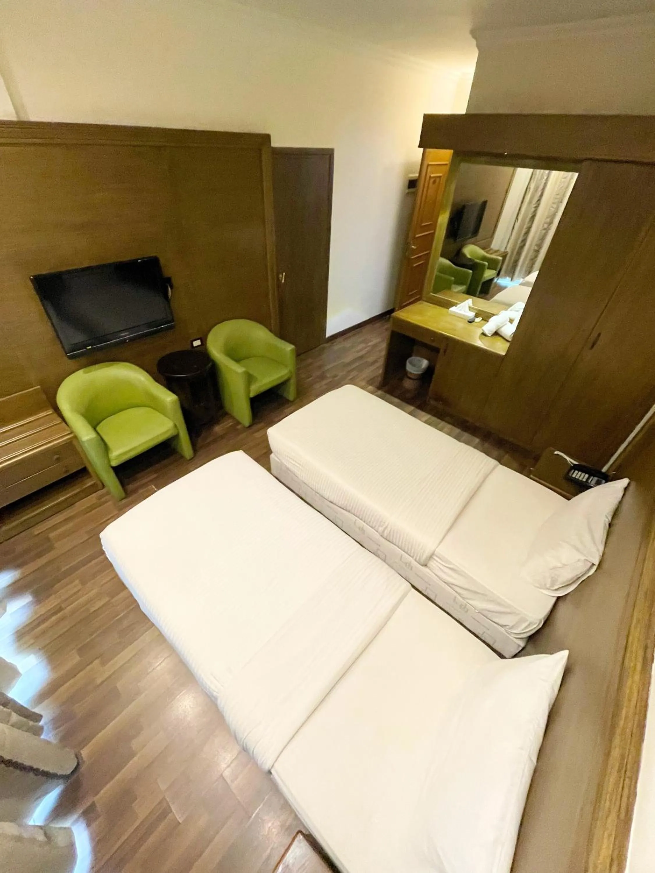 Bed in Royal Garden Hotel