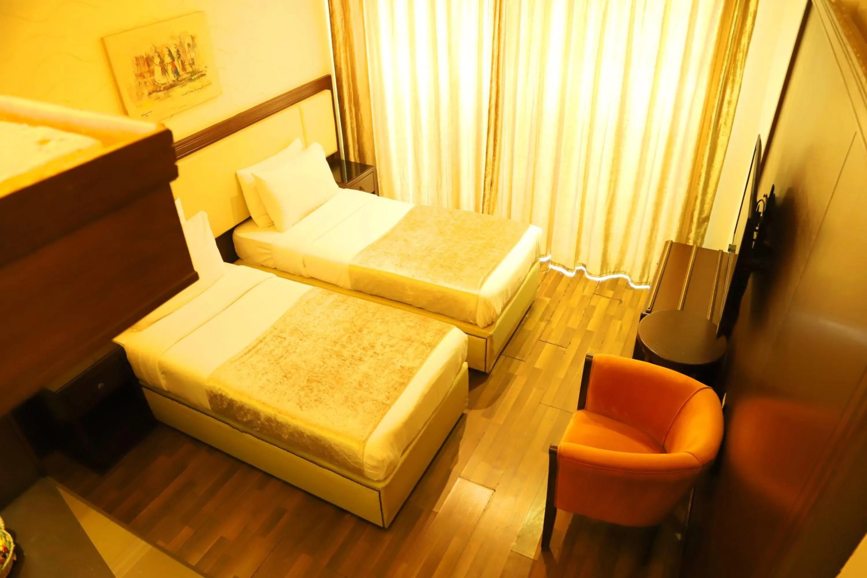 Bed in Royal Garden Hotel