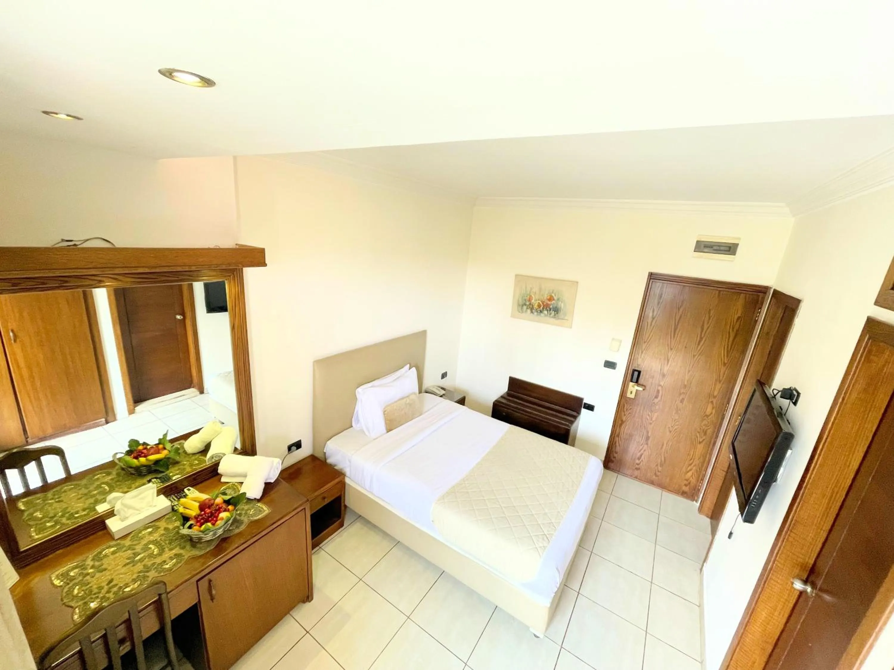 Bed in Royal Garden Hotel