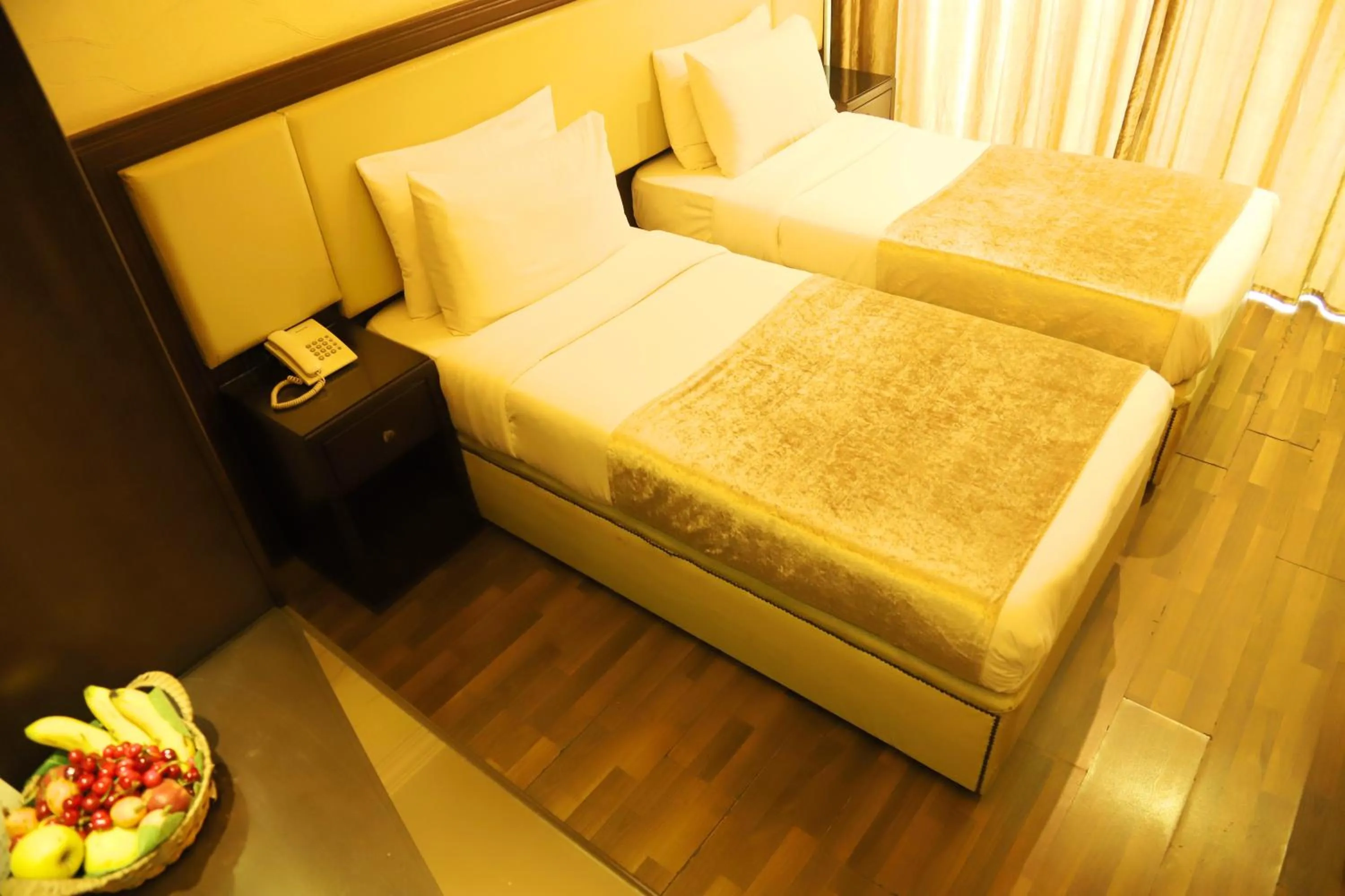 Bed in Royal Garden Hotel