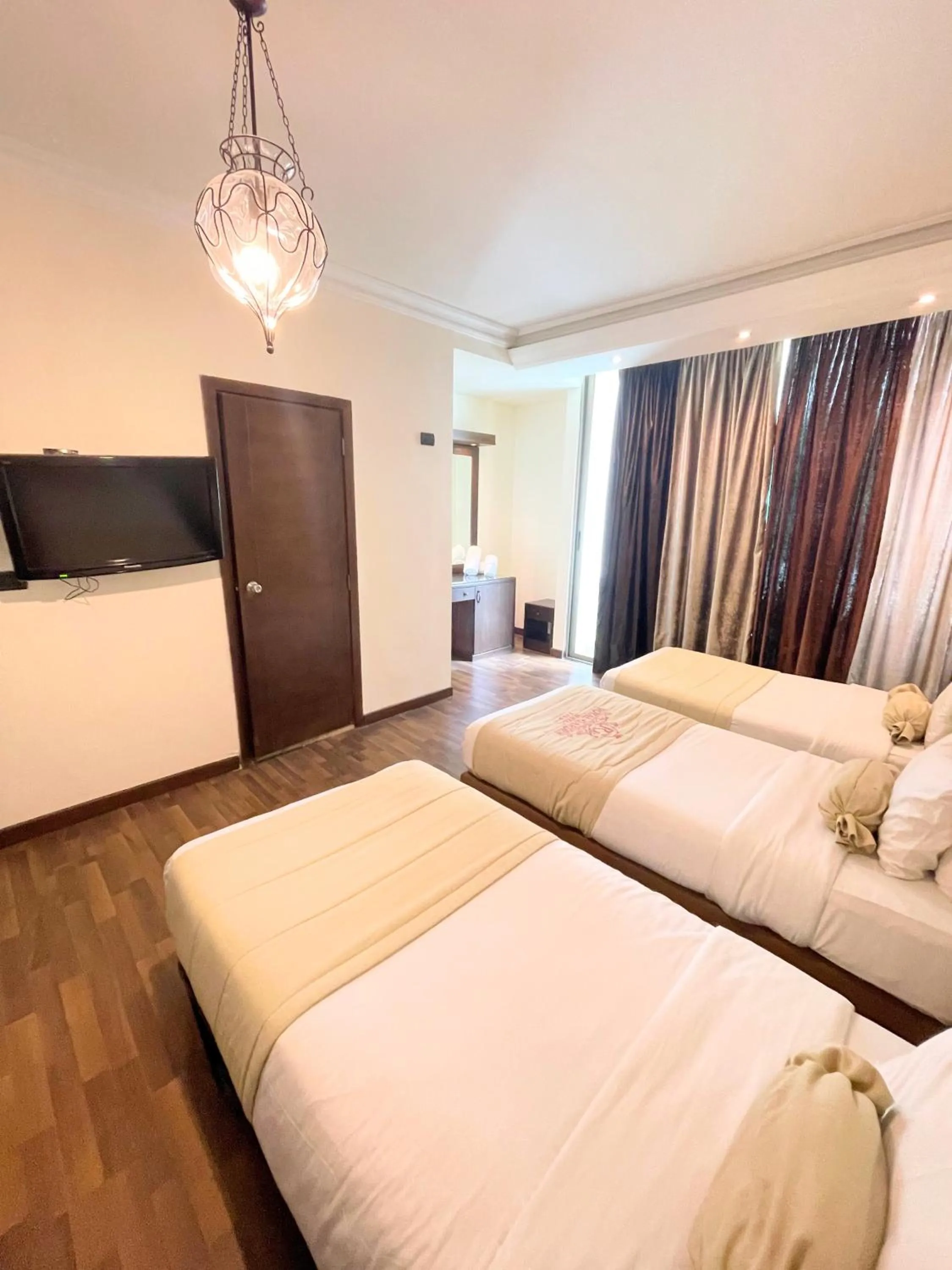 Bed in Royal Garden Hotel