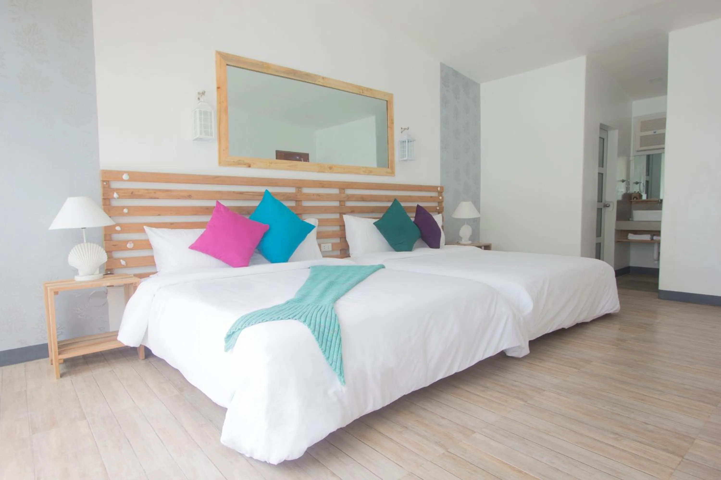 Bed in L'Sirene Boutique Resort