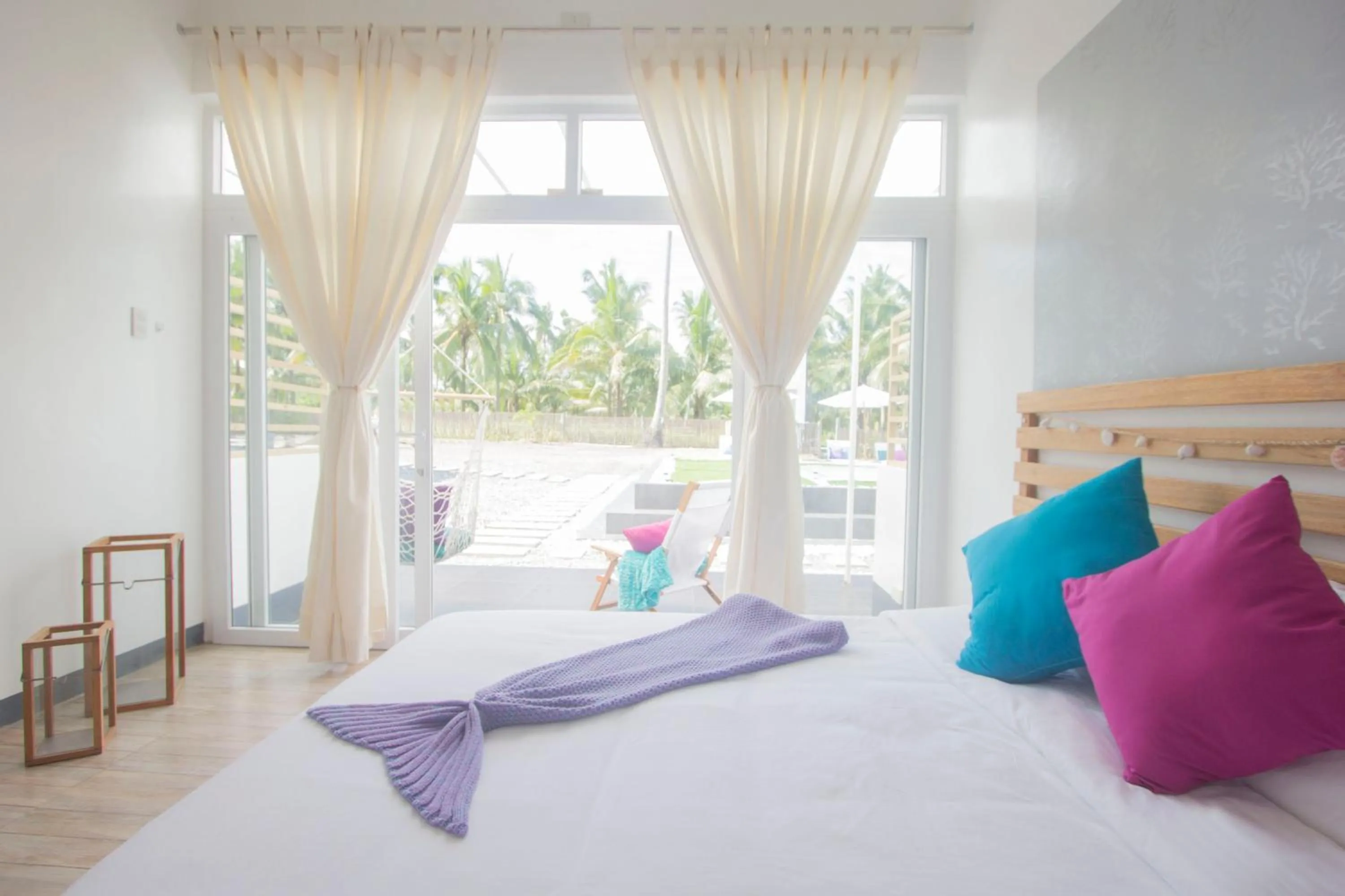 Bed in L'Sirene Boutique Resort