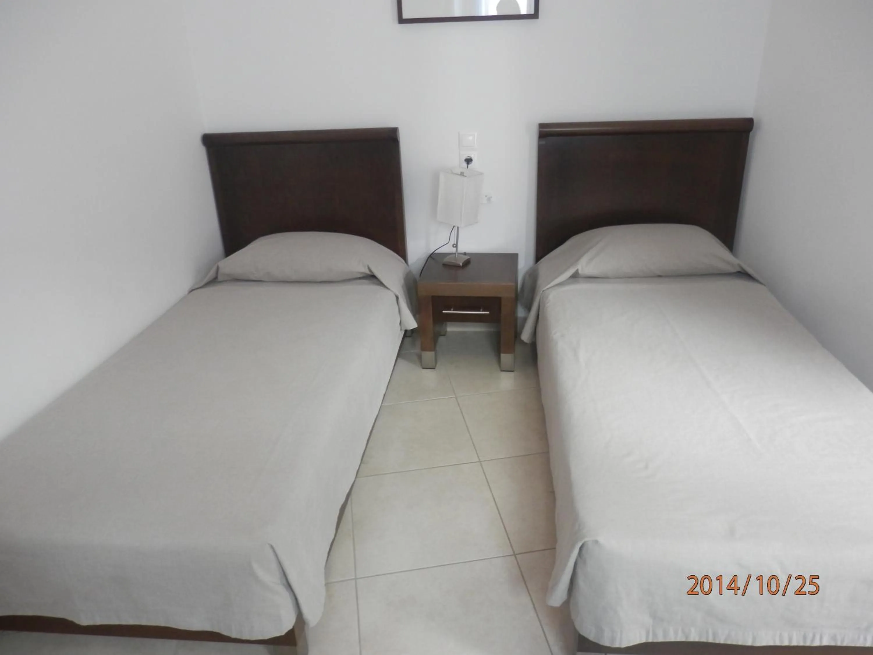 Bed in Glaros Hotel Apartment