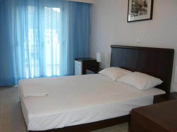 Bed in Glaros Hotel Apartment