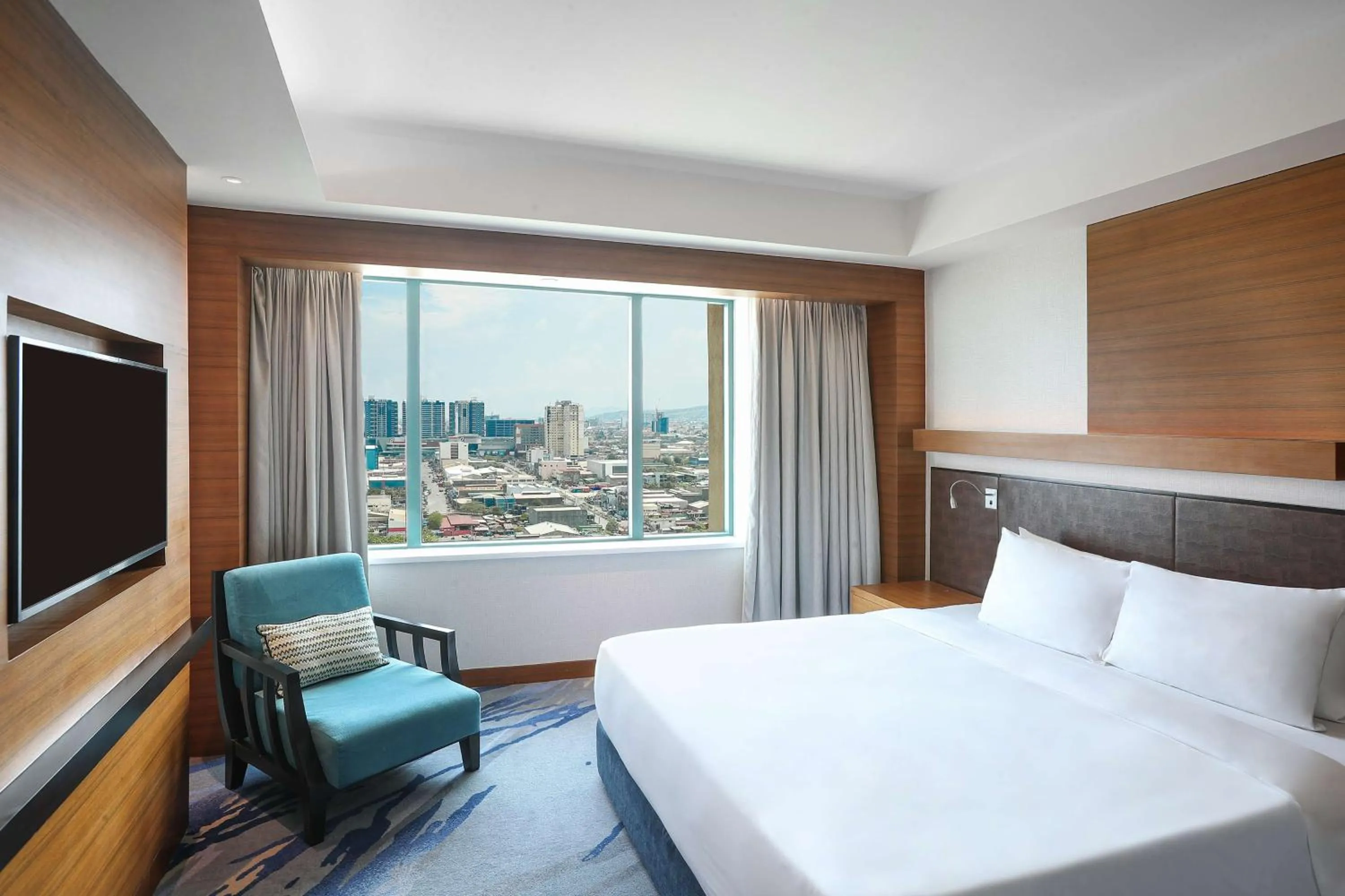 Photo of the whole room, Bed in Radisson Blu Cebu