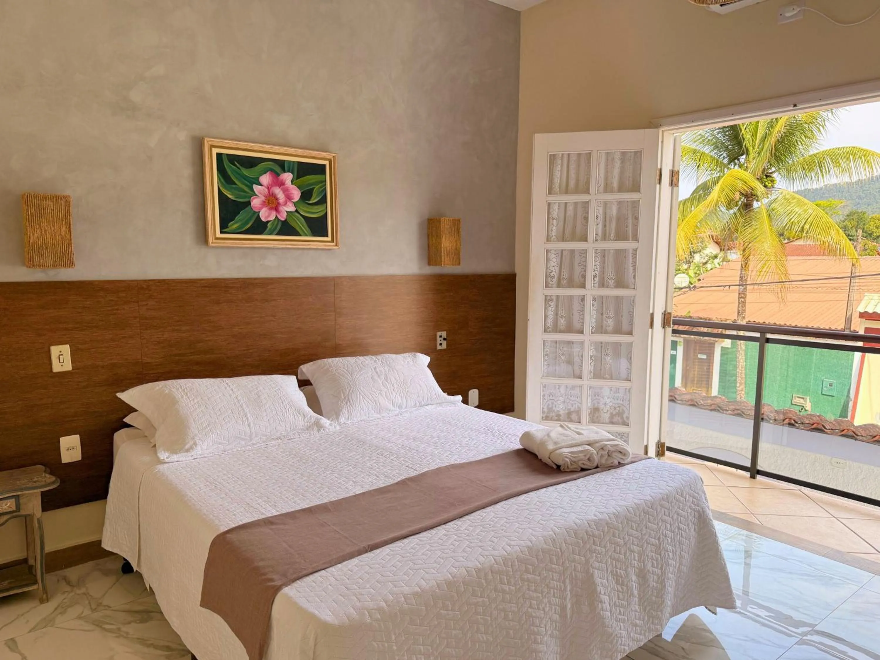 Bed in Pousada Larissa - com Gerador de Energia