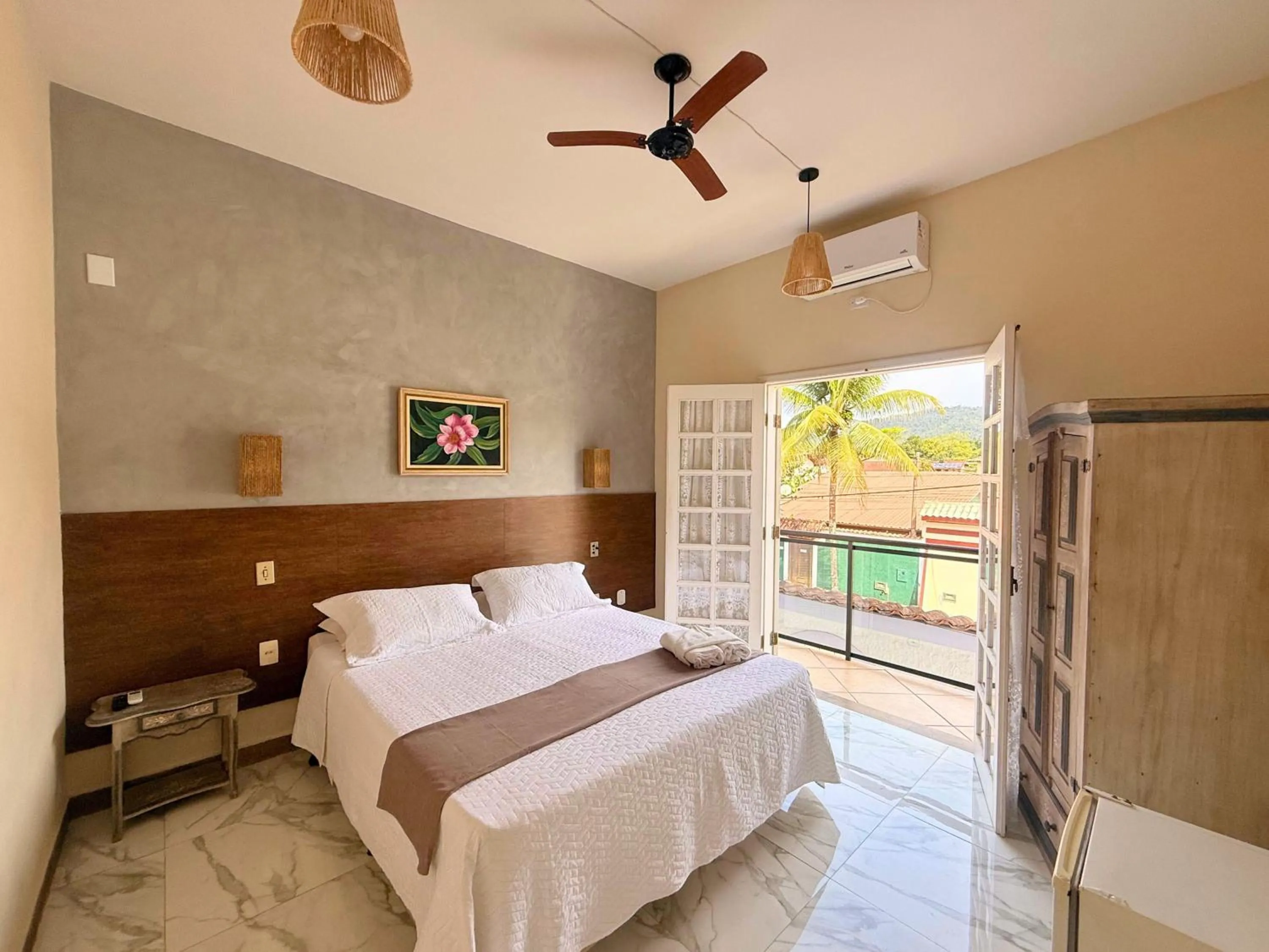 Bed in Pousada Larissa - com Gerador de Energia