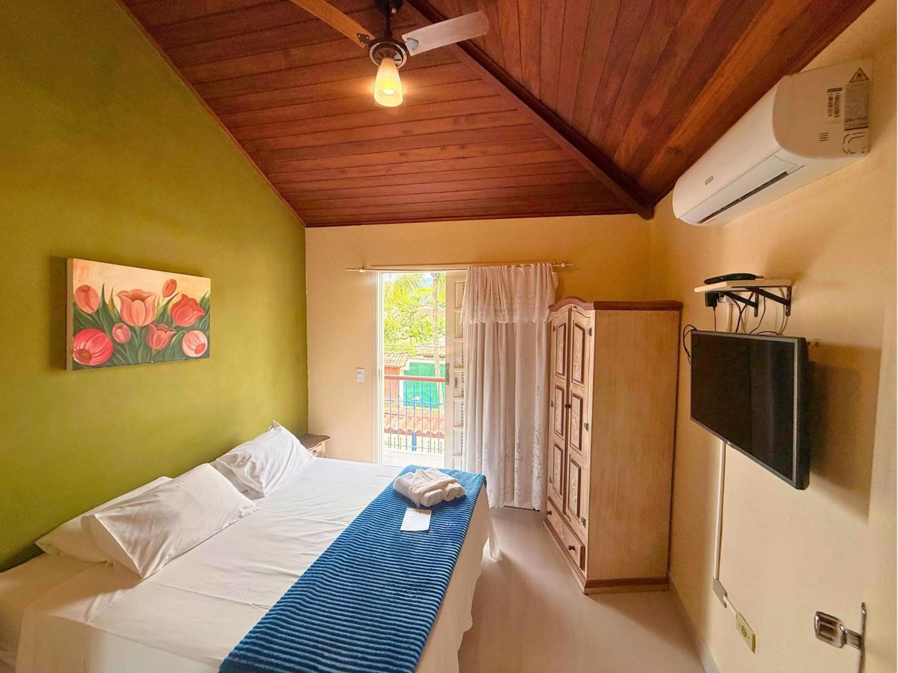 Bed in Pousada Larissa - com Gerador de Energia