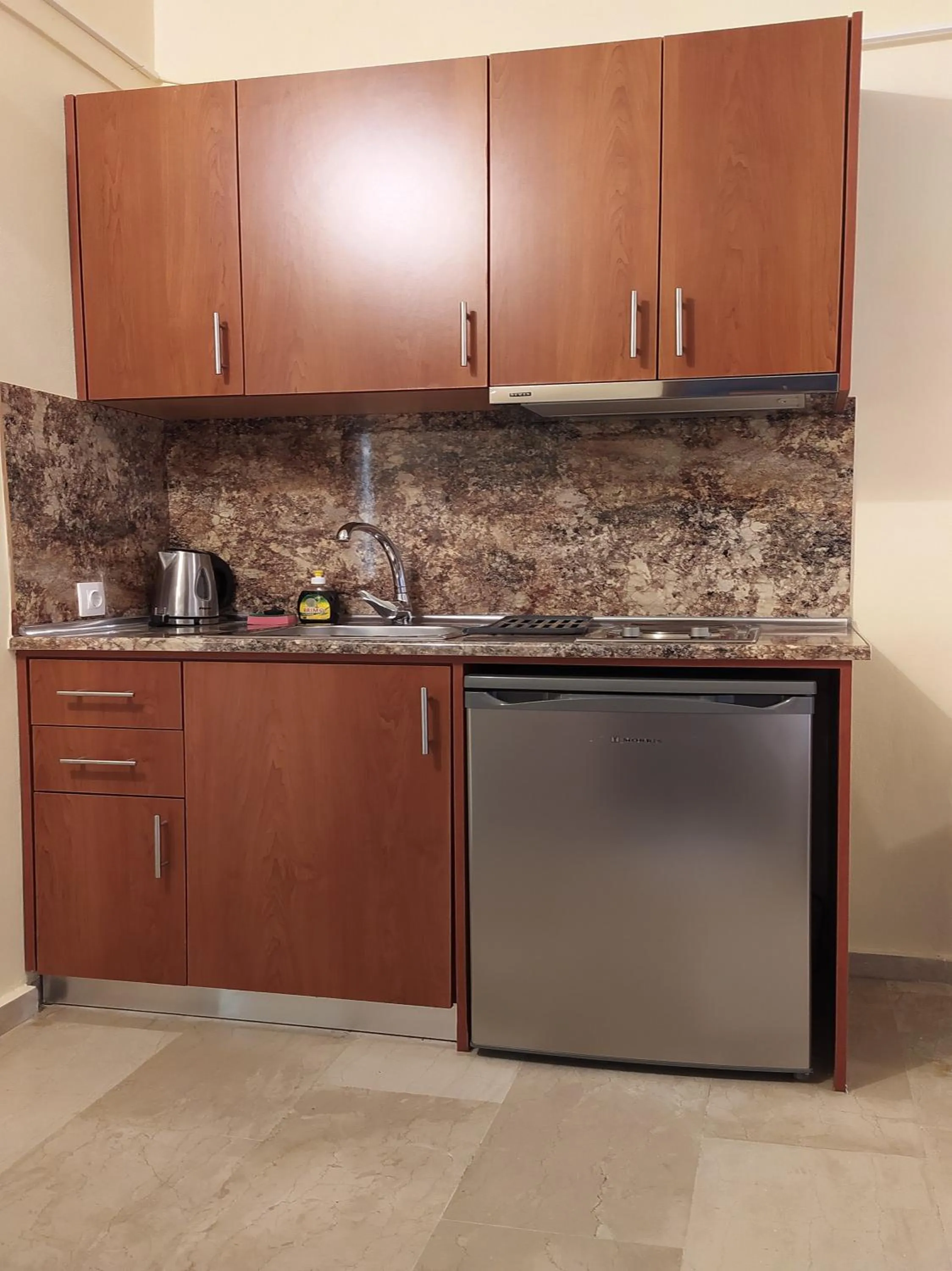 Kitchen or kitchenette in Toula's Apartments
