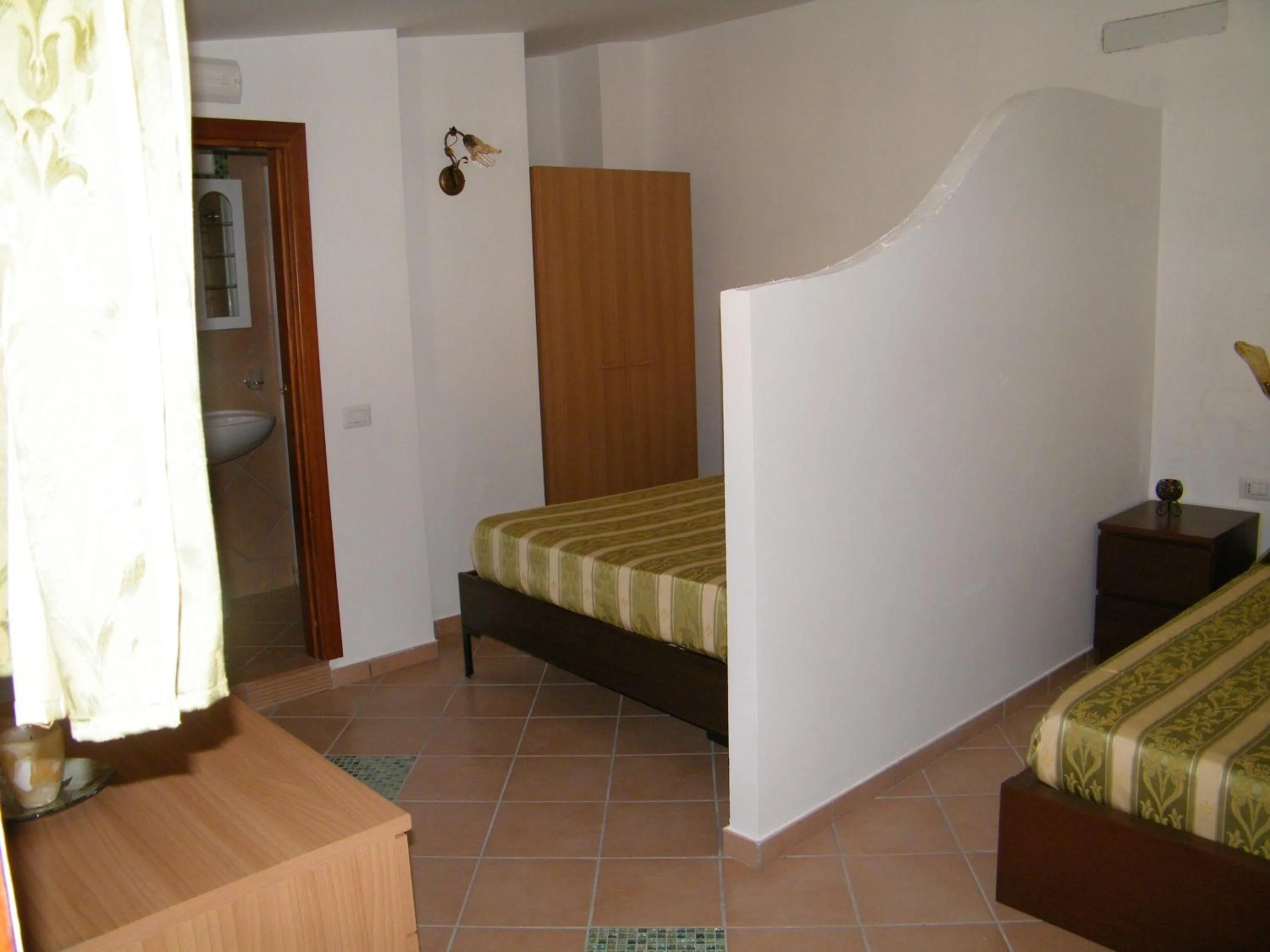 Decorative detail, Bed in Hotel Villaggio Tabù