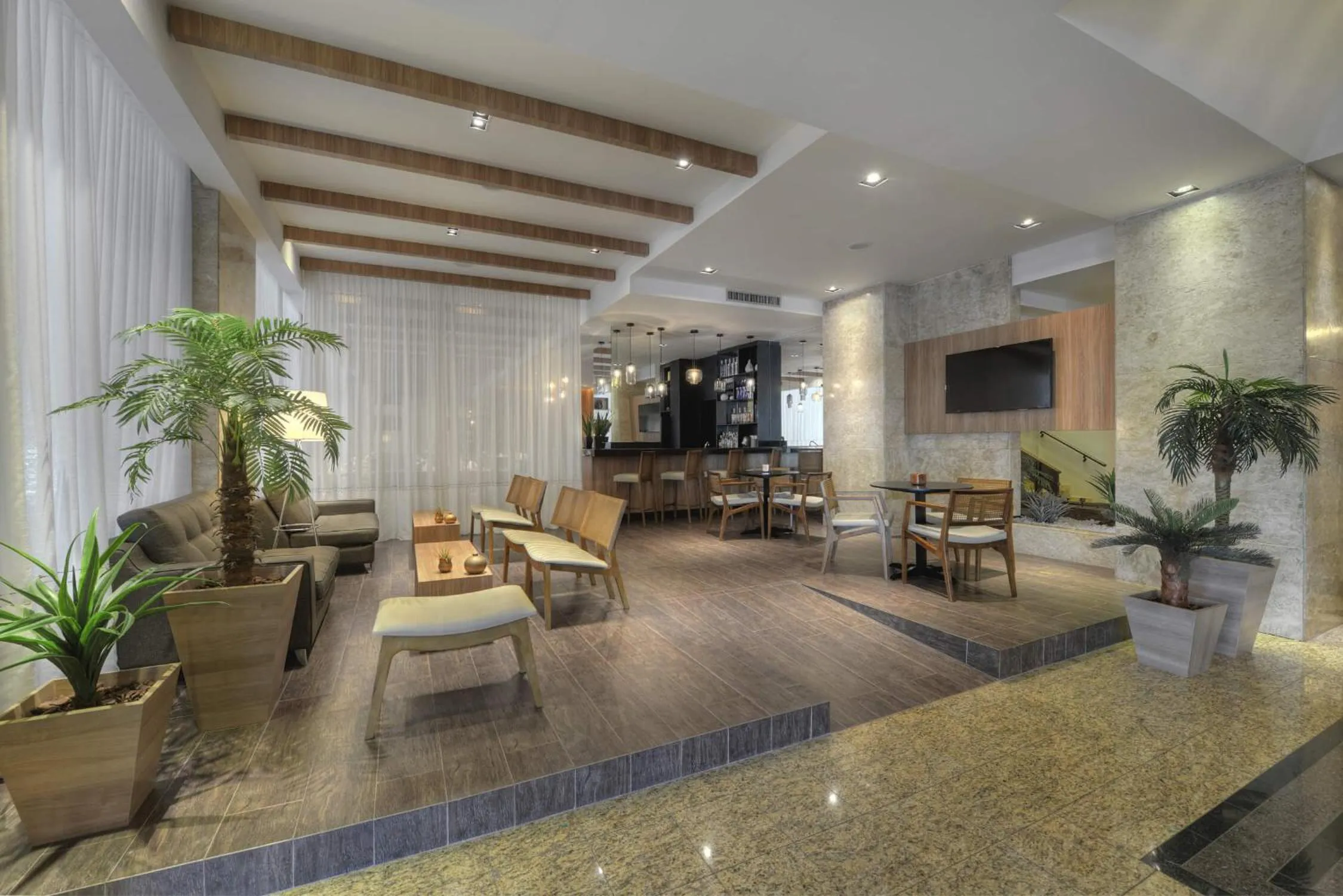 Living room in Hotel Deville Business Maringá