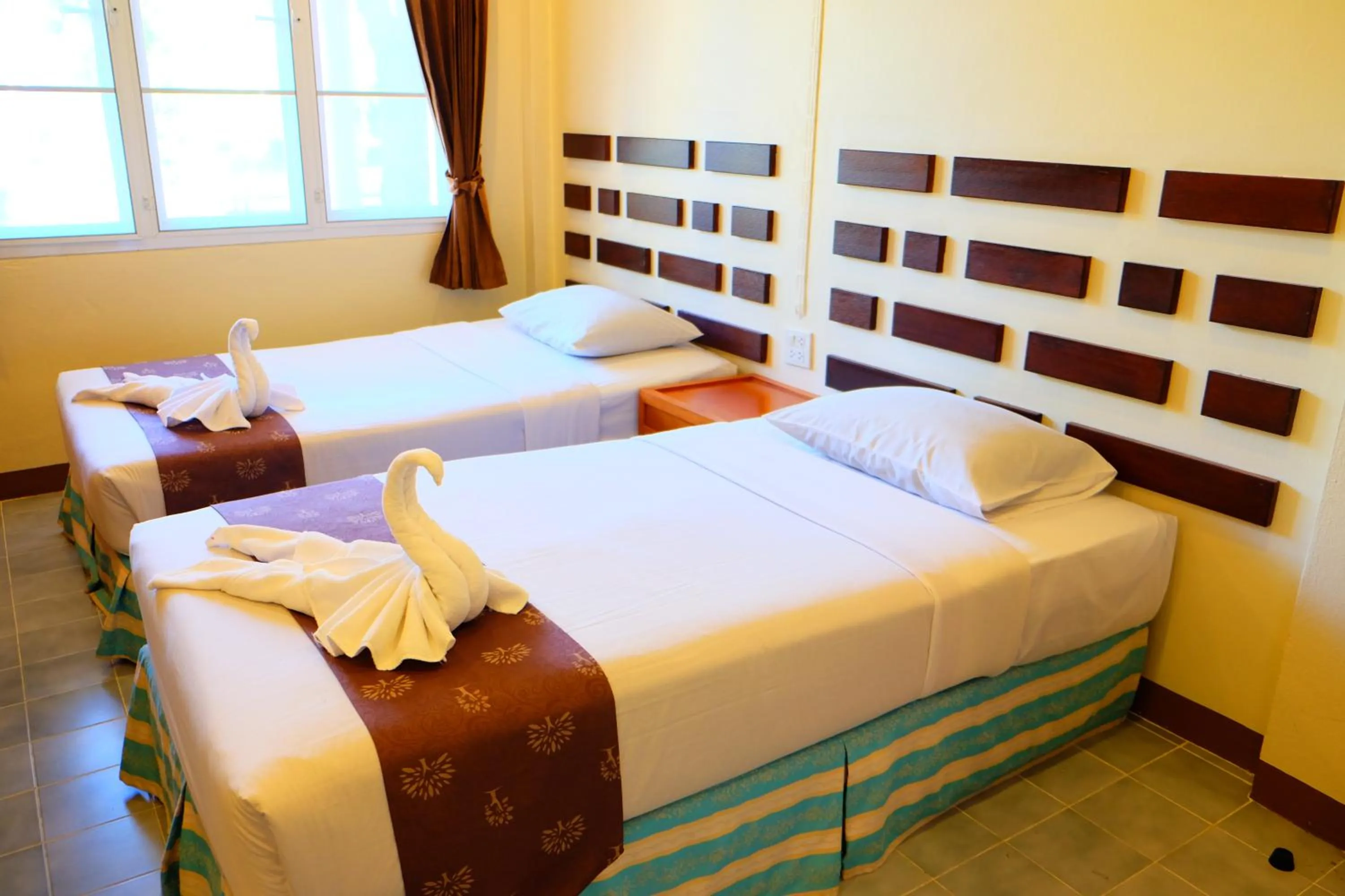 Bed in New Travel Beach Hotel & Resort