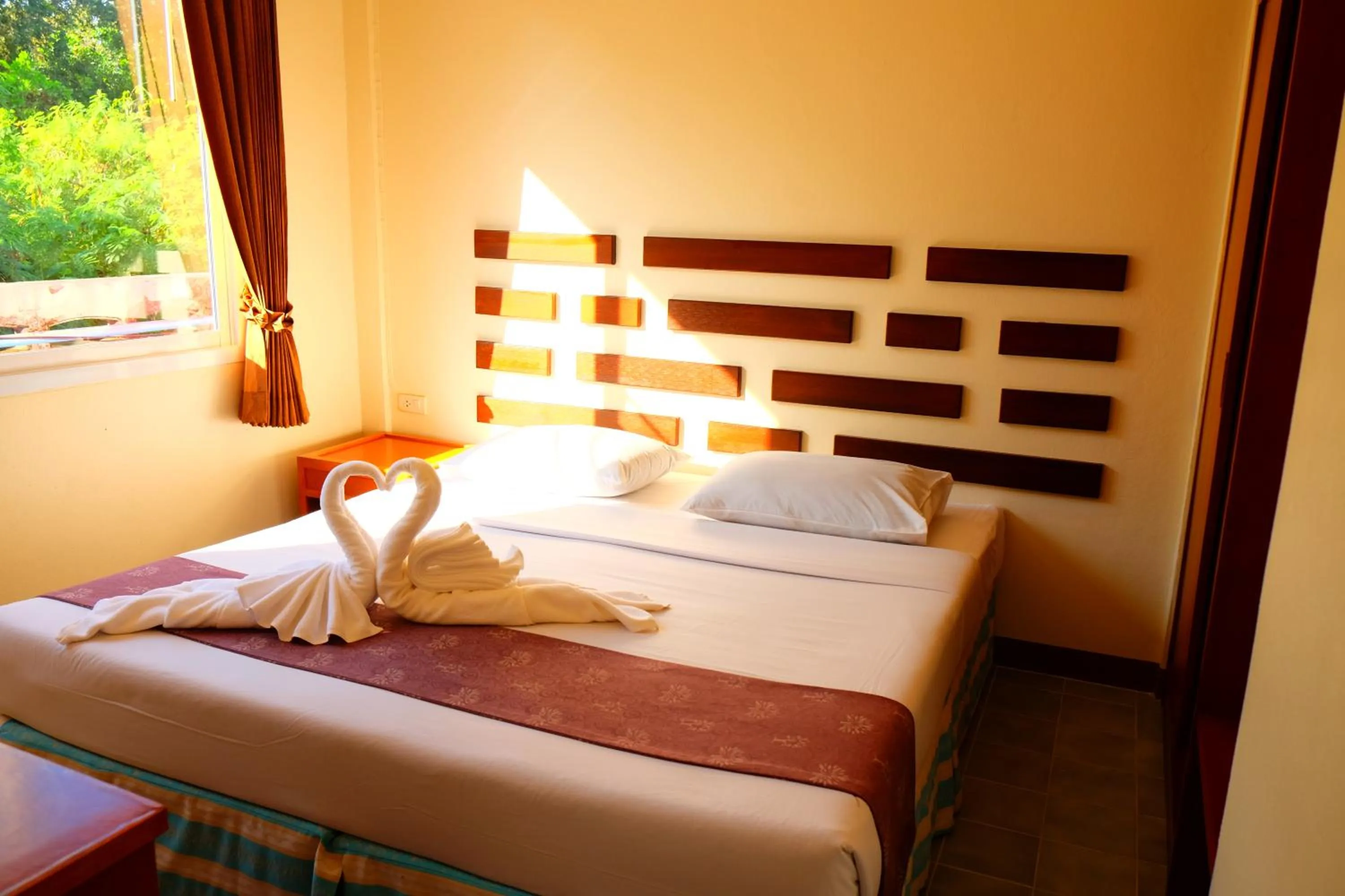 Bed in New Travel Beach Hotel & Resort