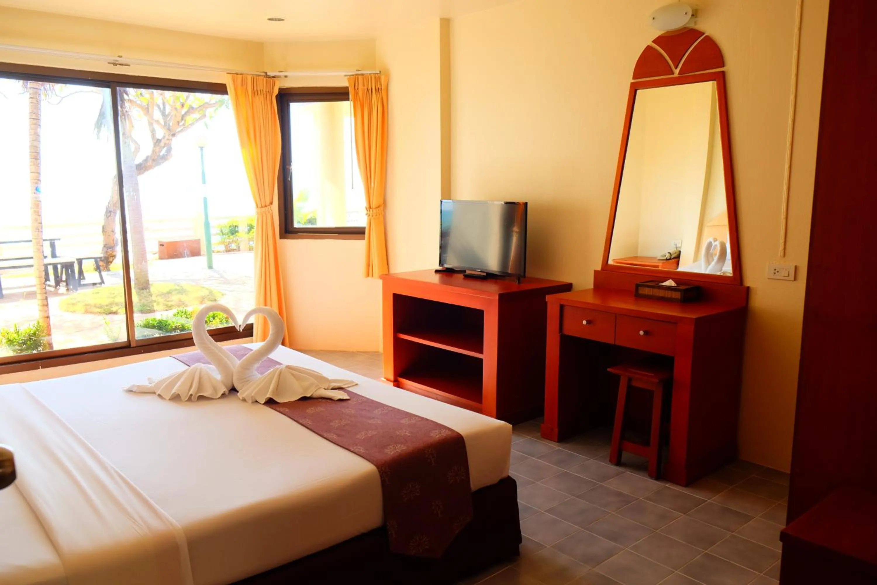 Bed in New Travel Beach Hotel & Resort