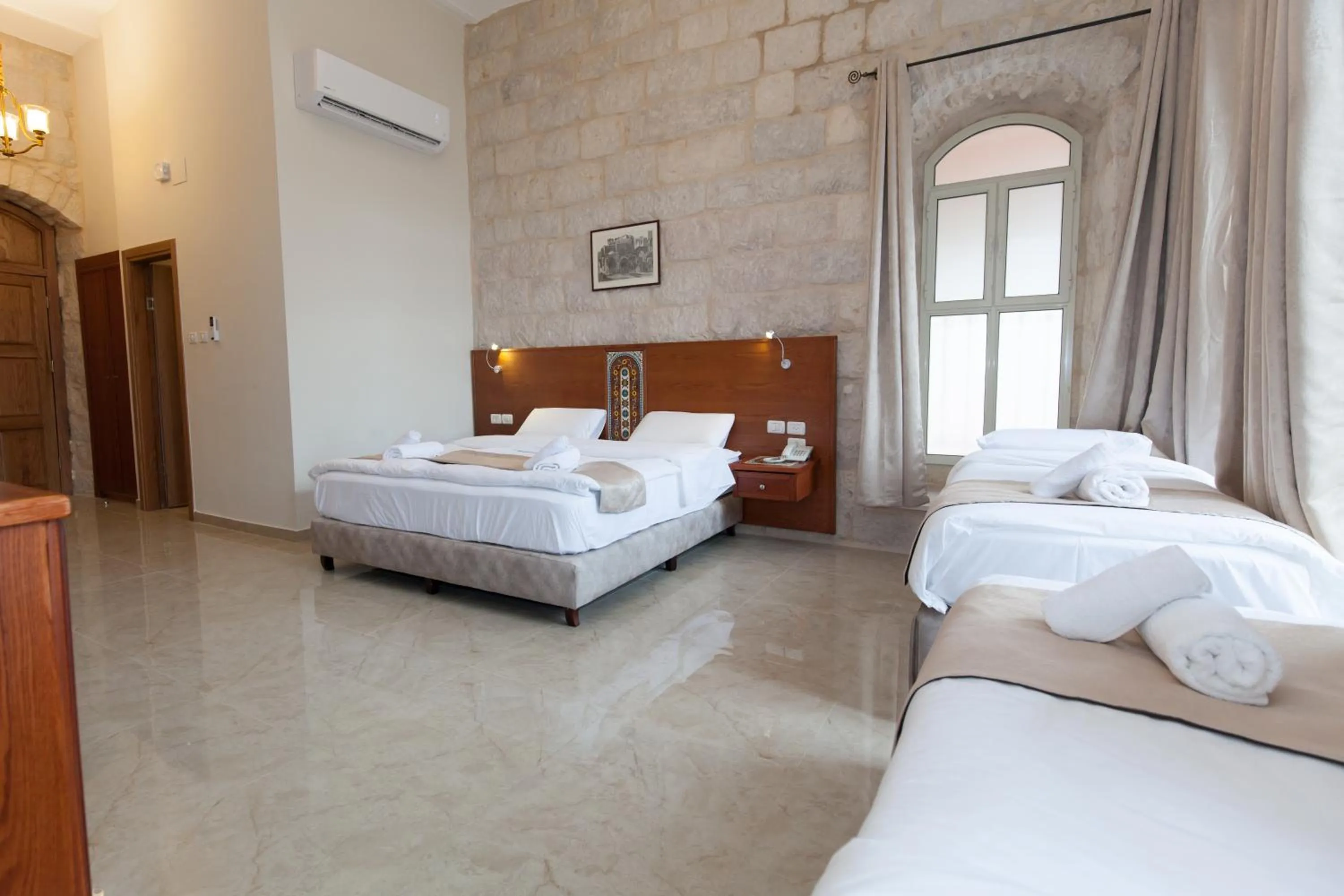 Photo of the whole room, Bed in Azzahra Boutique Hotel & Restaurant - Jerusalem