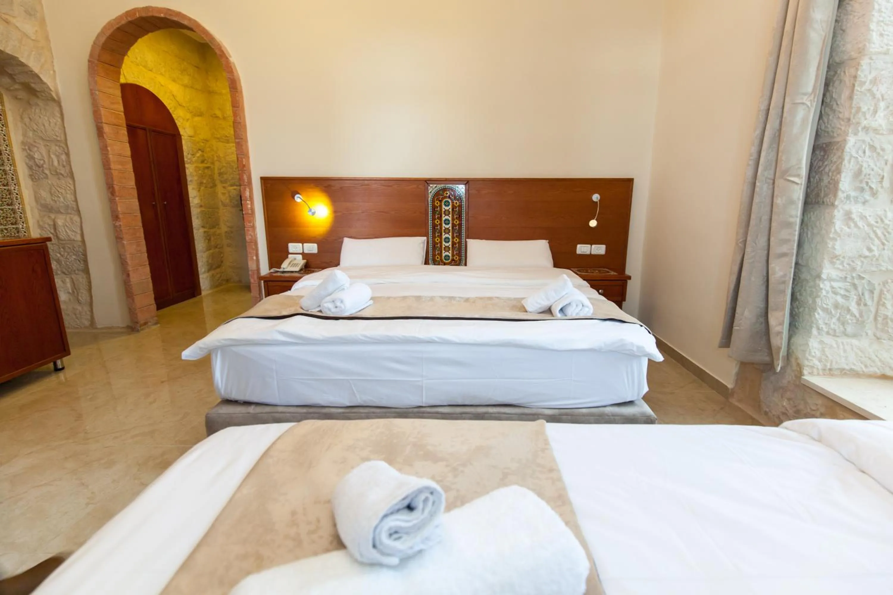 Photo of the whole room, Bed in Azzahra Boutique Hotel & Restaurant - Jerusalem