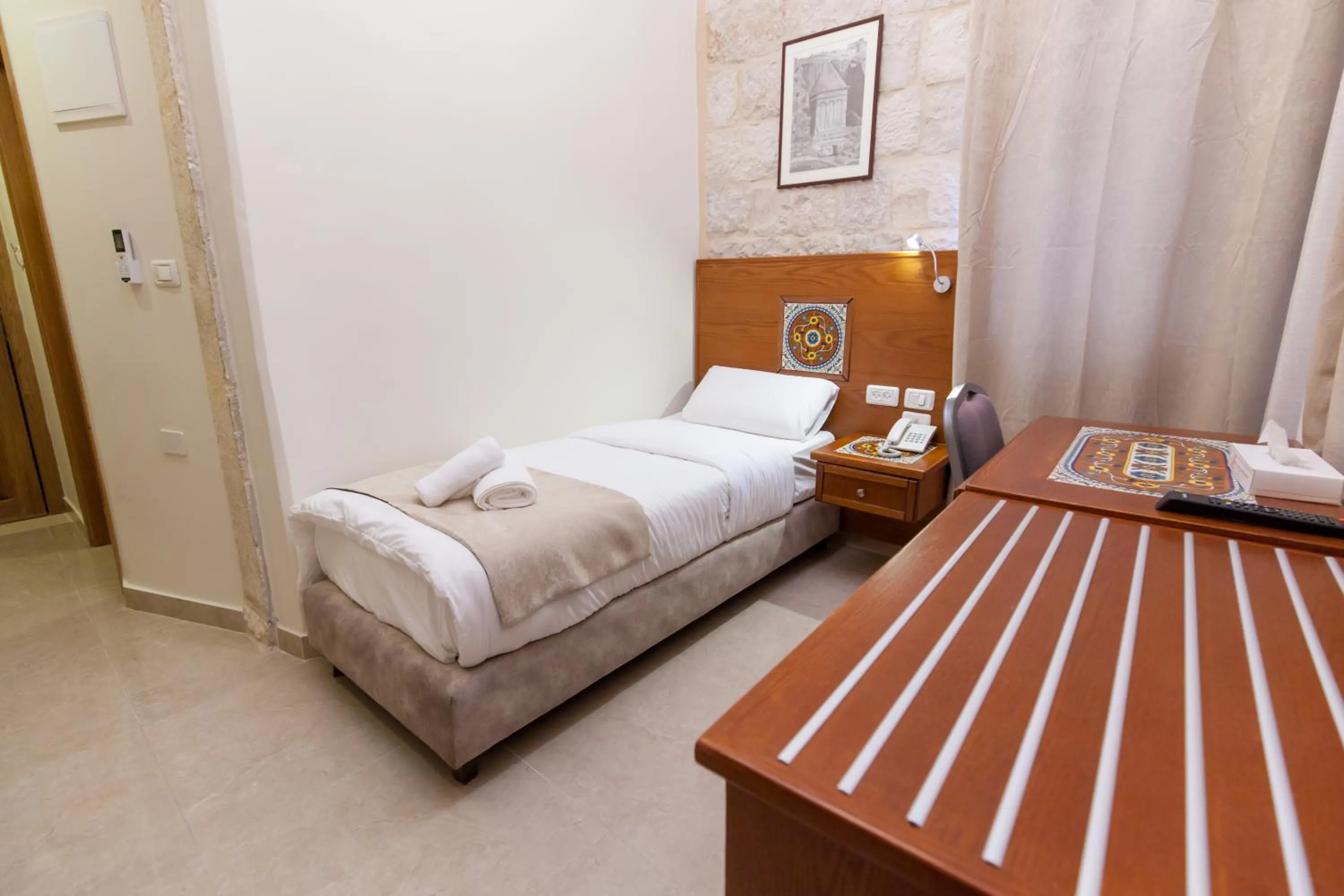 Photo of the whole room, Bed in Azzahra Boutique Hotel & Restaurant - Jerusalem