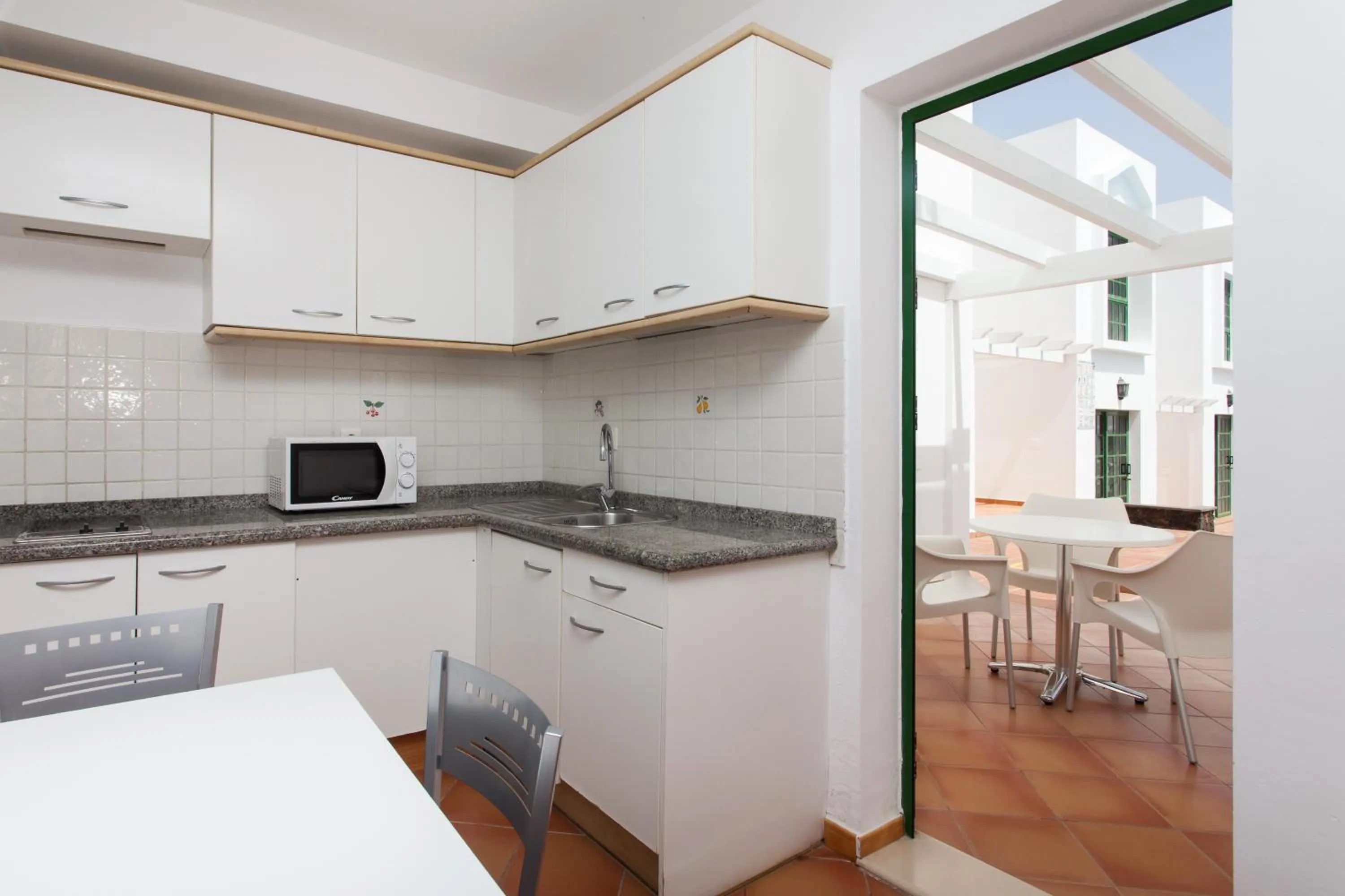 Kitchen or kitchenette in TAO Caleta Playa