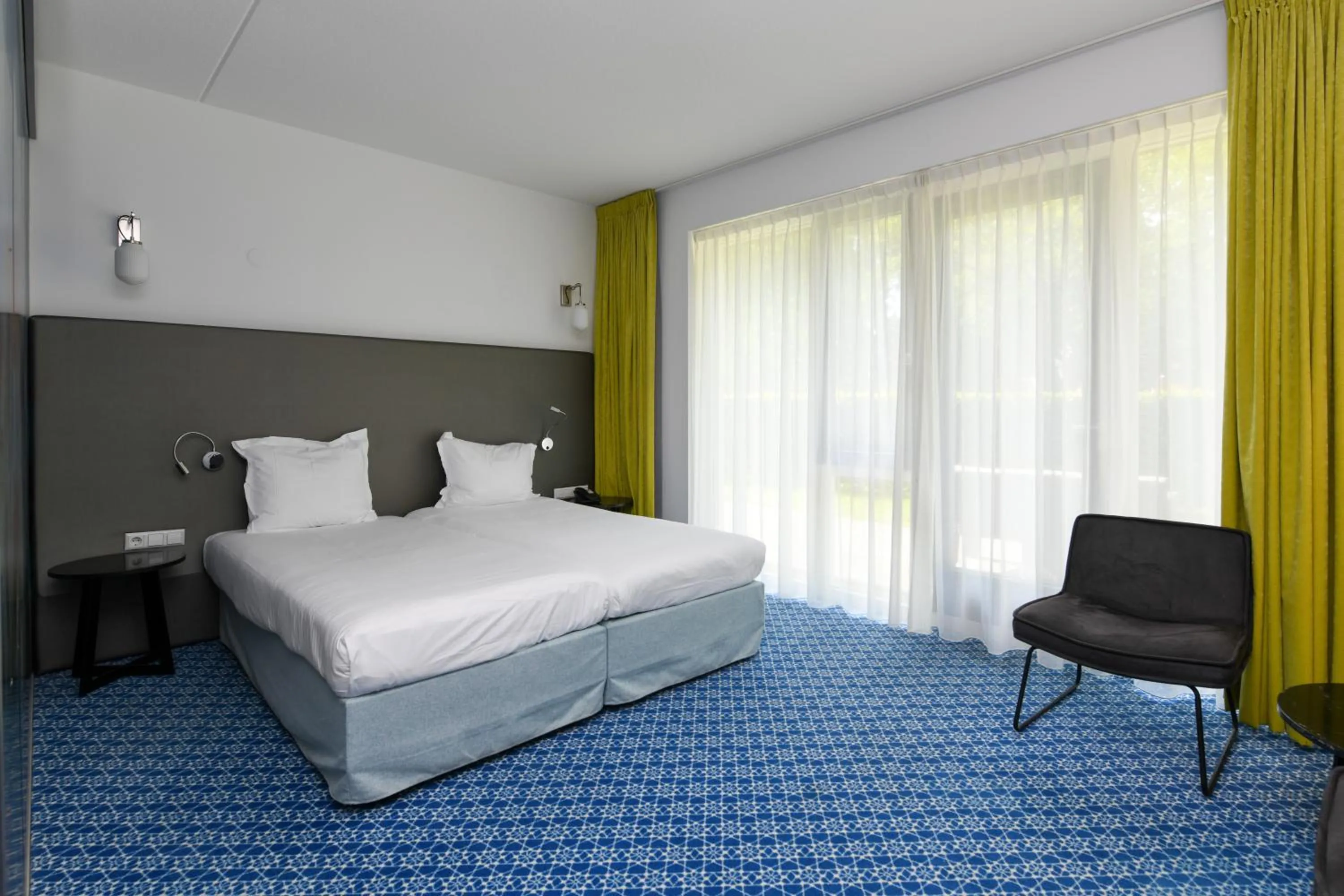 Bed in Hotel De Roode Schuur