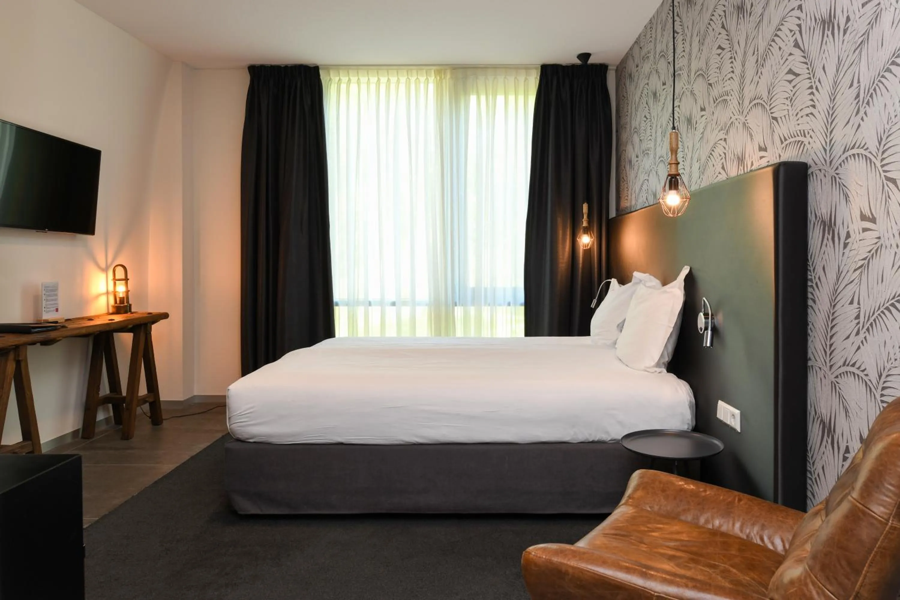 Bed in Hotel De Roode Schuur