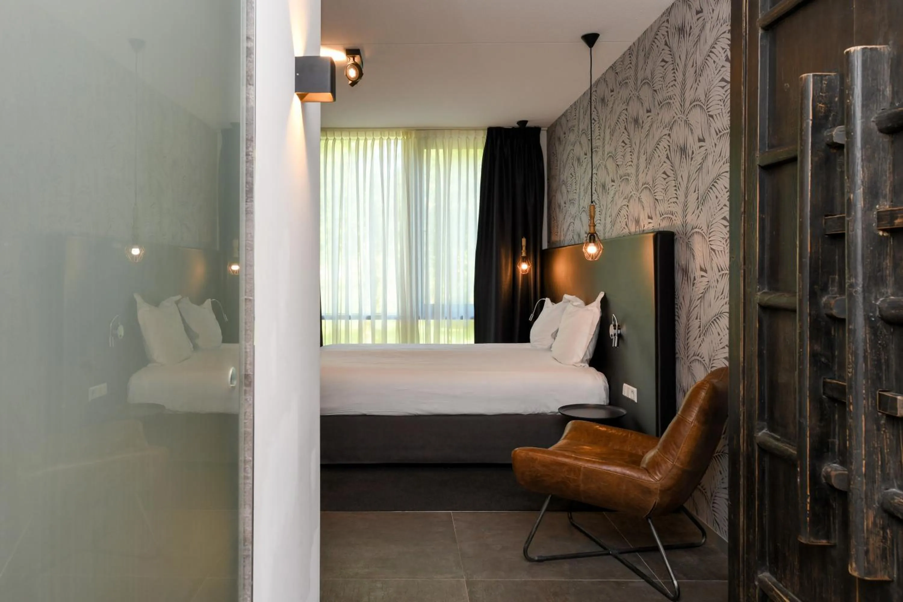 Bed in Hotel De Roode Schuur