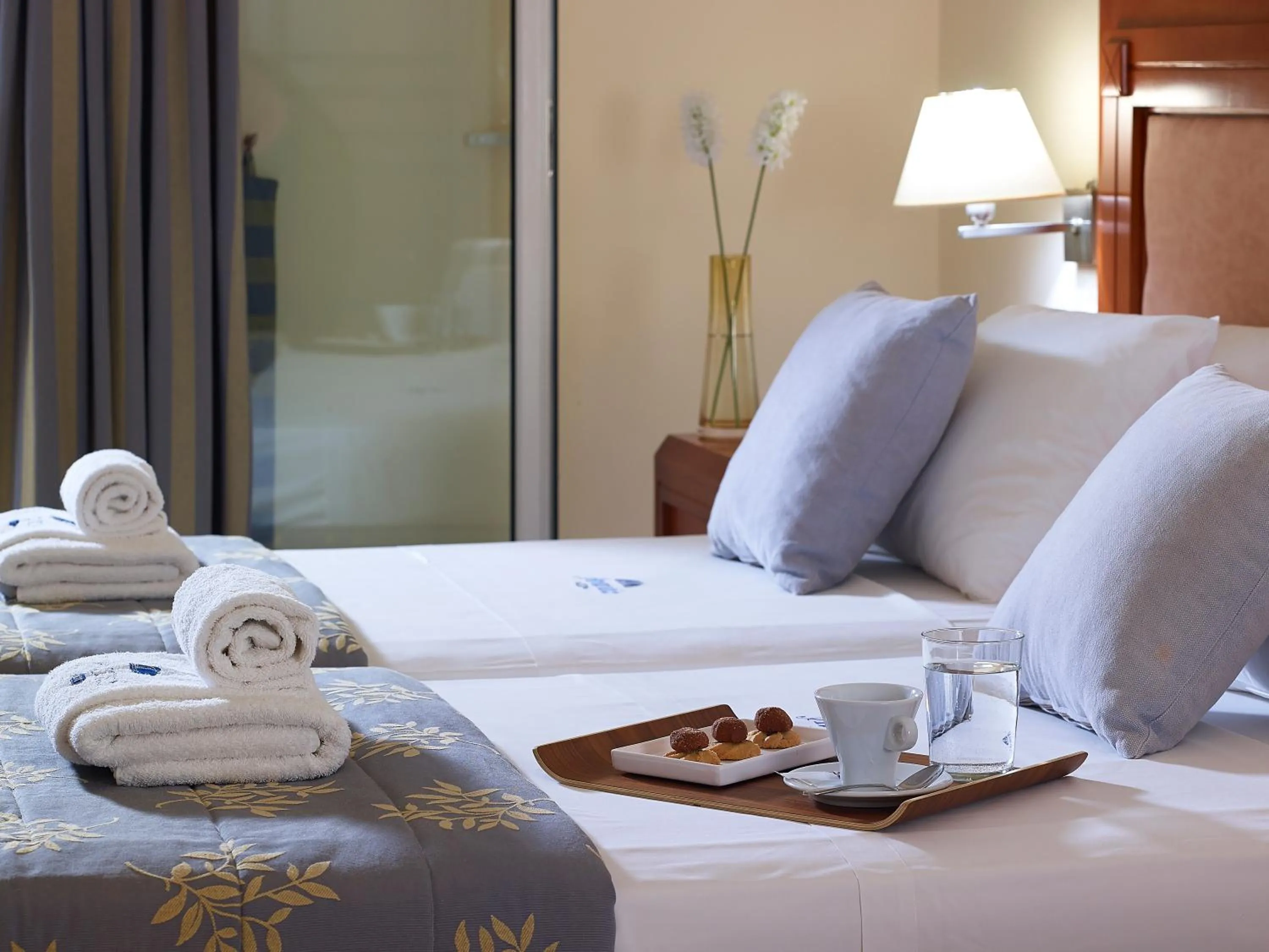 Bed in Avantis Suites Hotel
