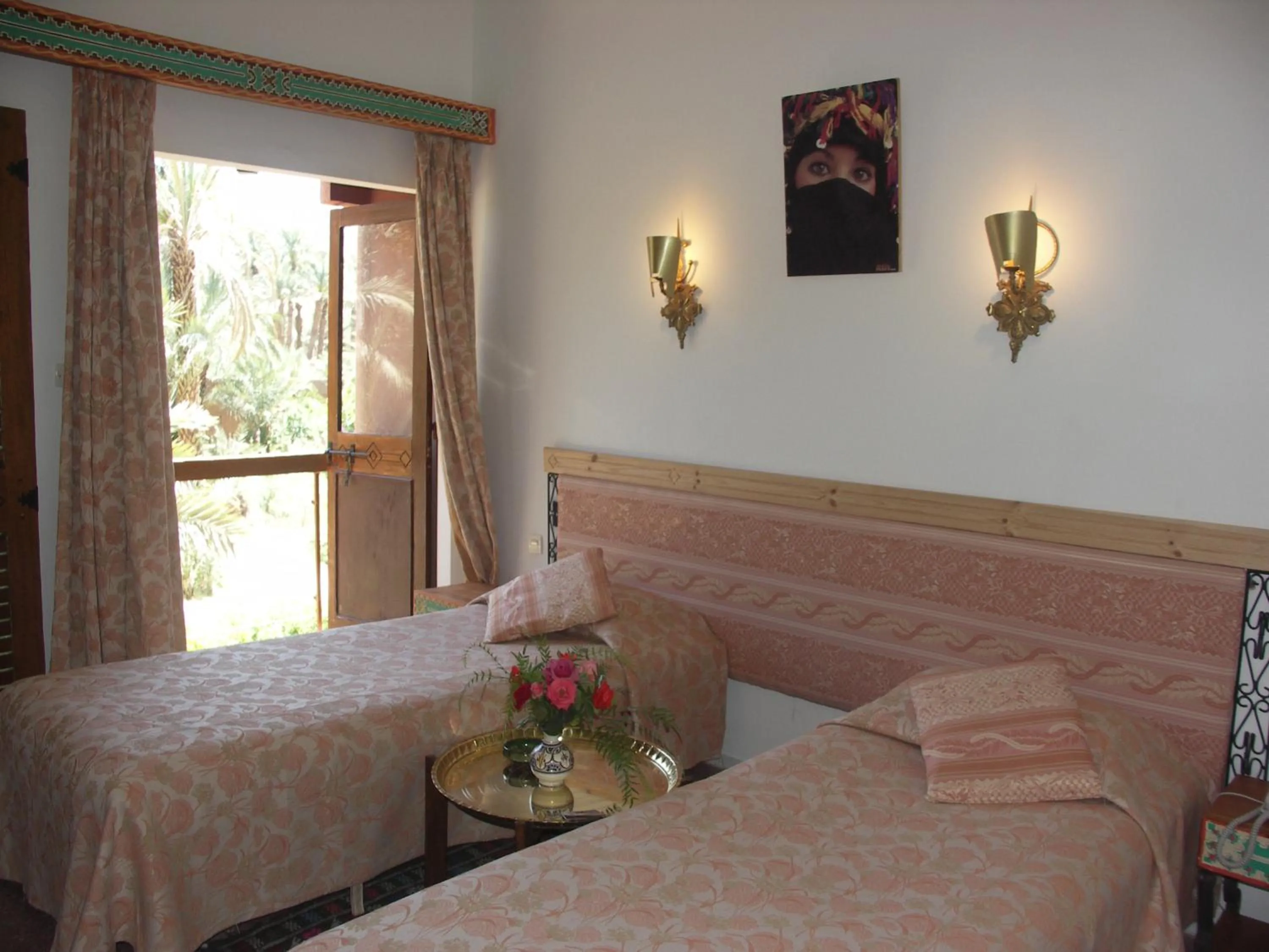 Photo of the whole room, Bed in Hôtel Le Tinsouline