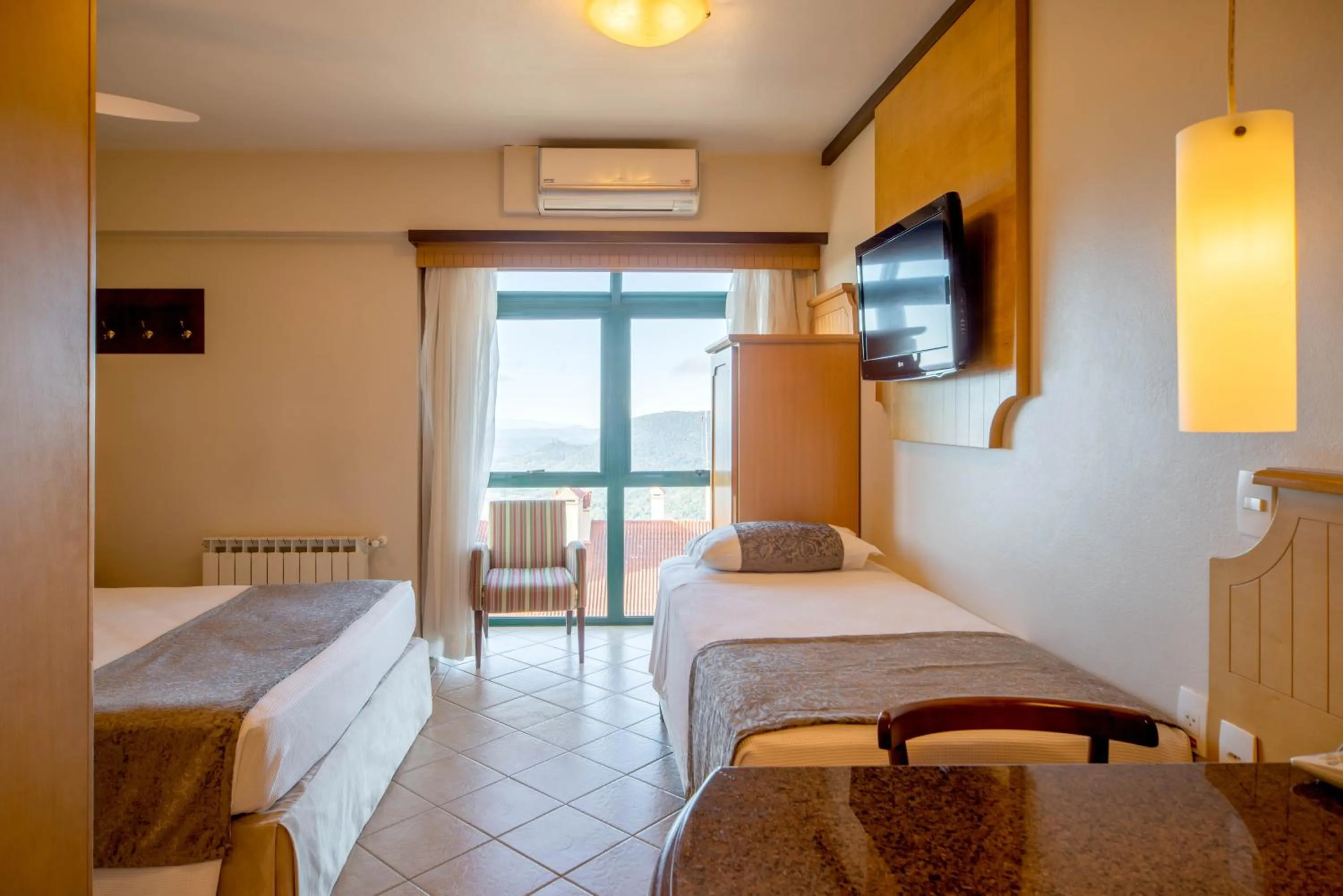 Bed in Hotel Laghetto Toscana