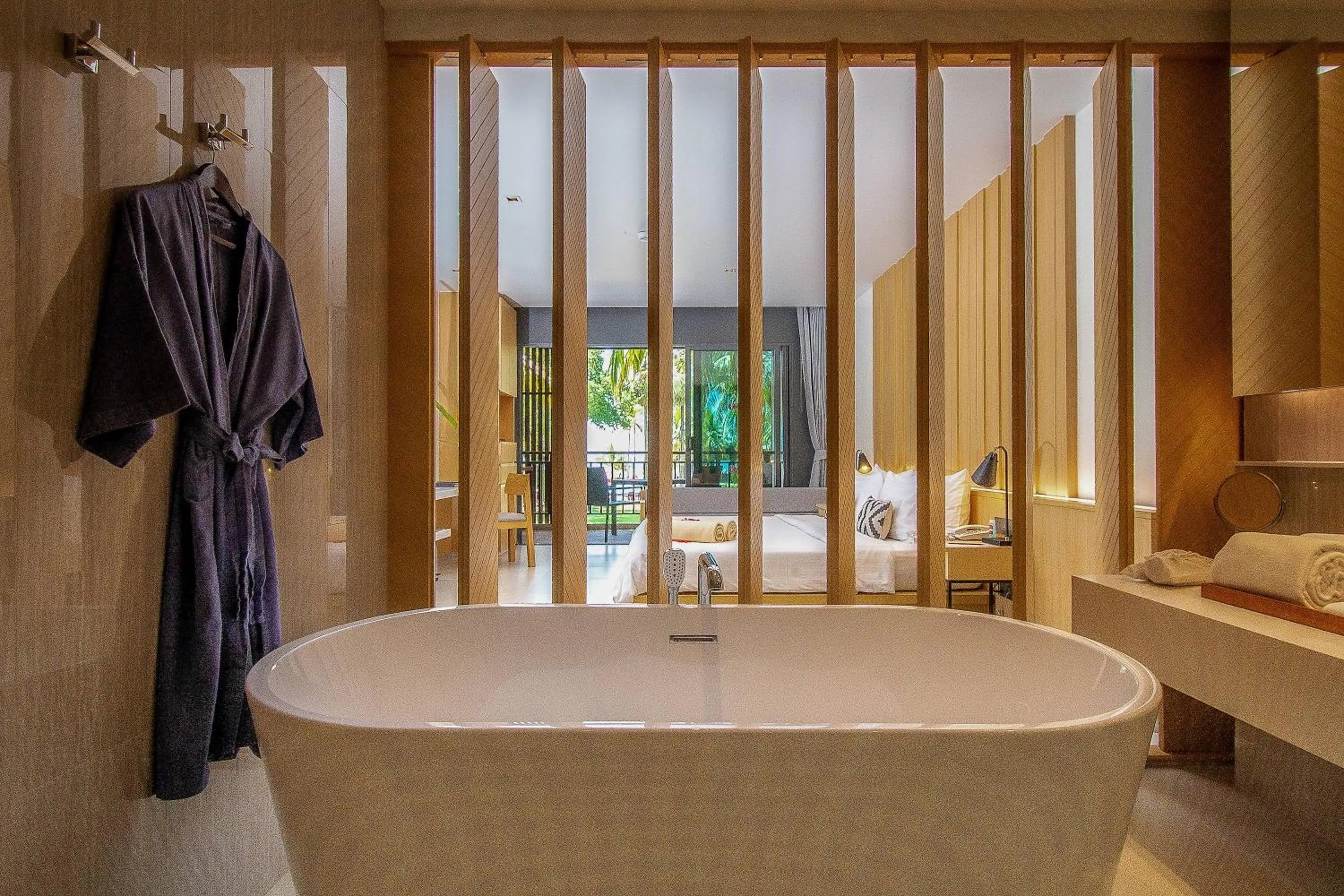Bathroom, Bed in Ramada Resort by Wyndham Khao Lak