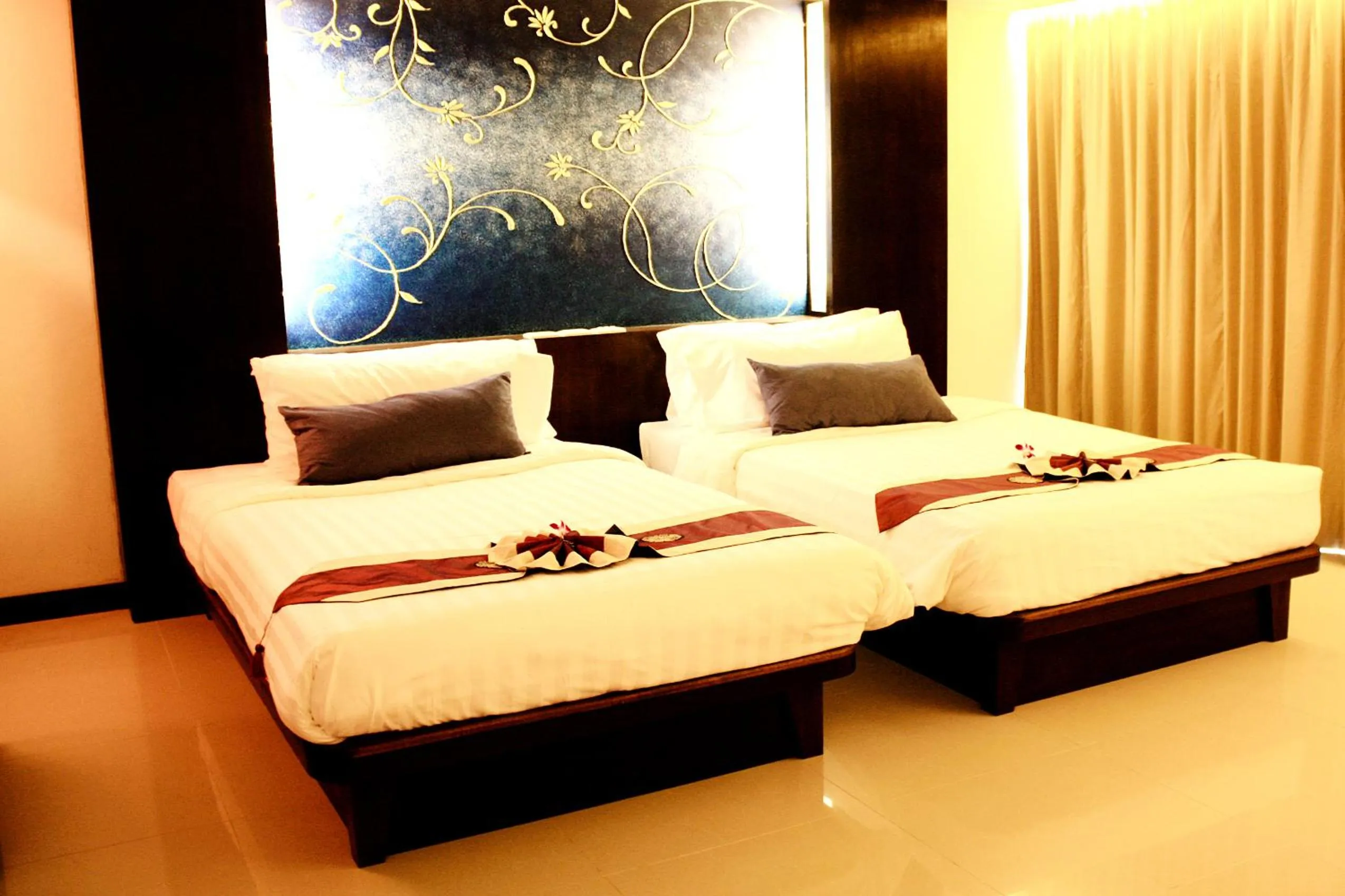 Bed in Khaolak Orchid Beach Resort - SHA Extra Plus