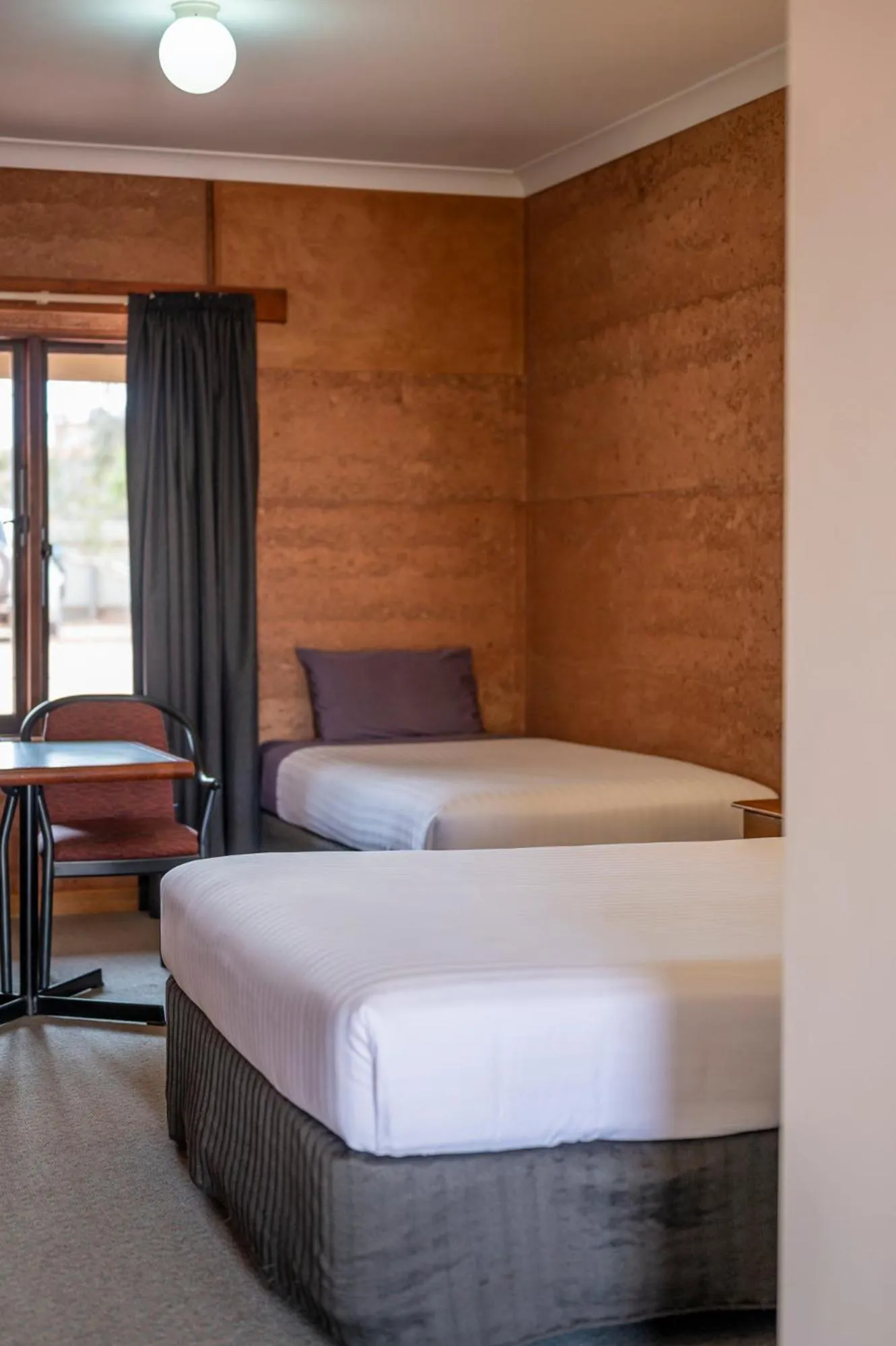 Bed in Mud Hut Motel