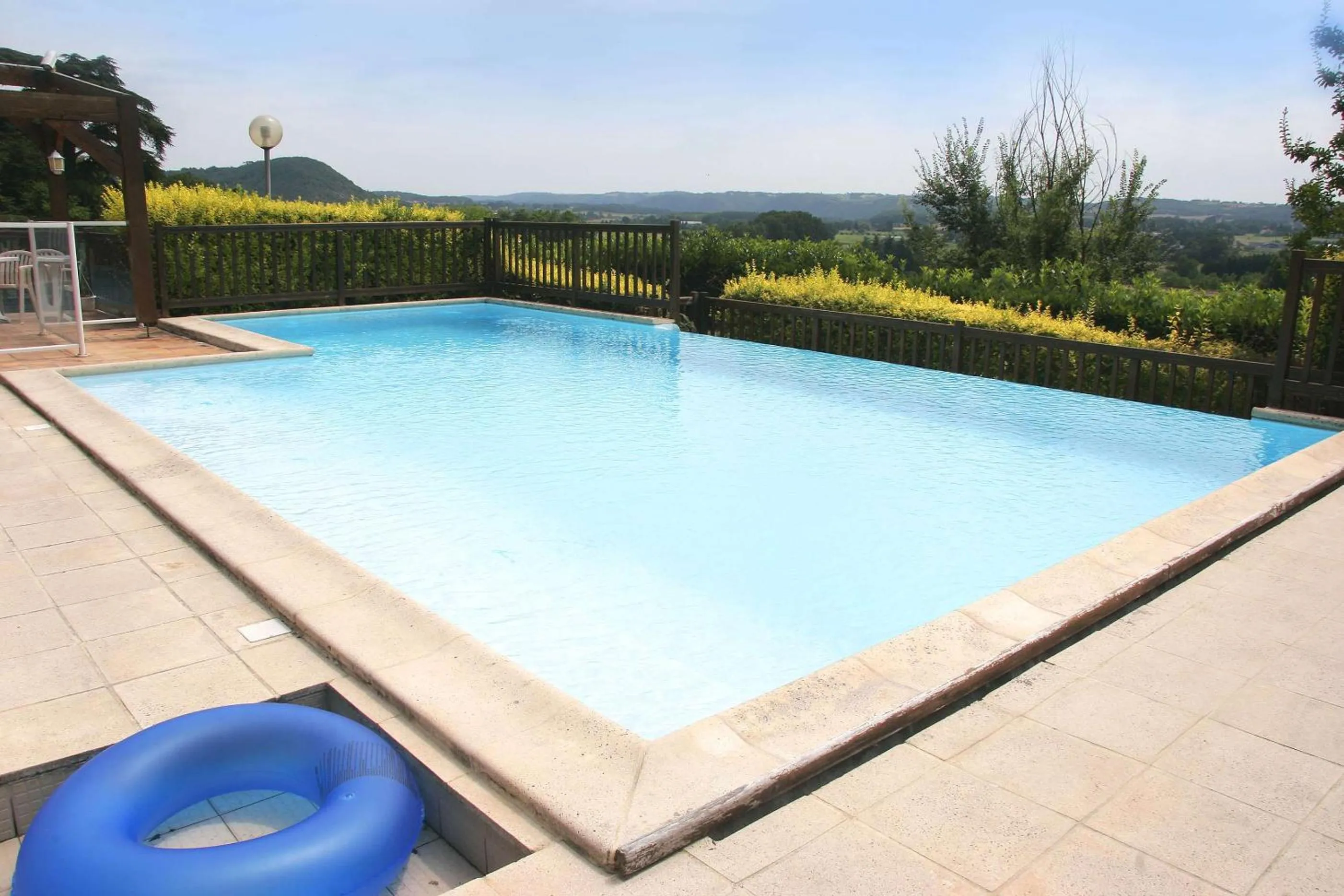 Pool view in Brit Hotel Vallee du Lot