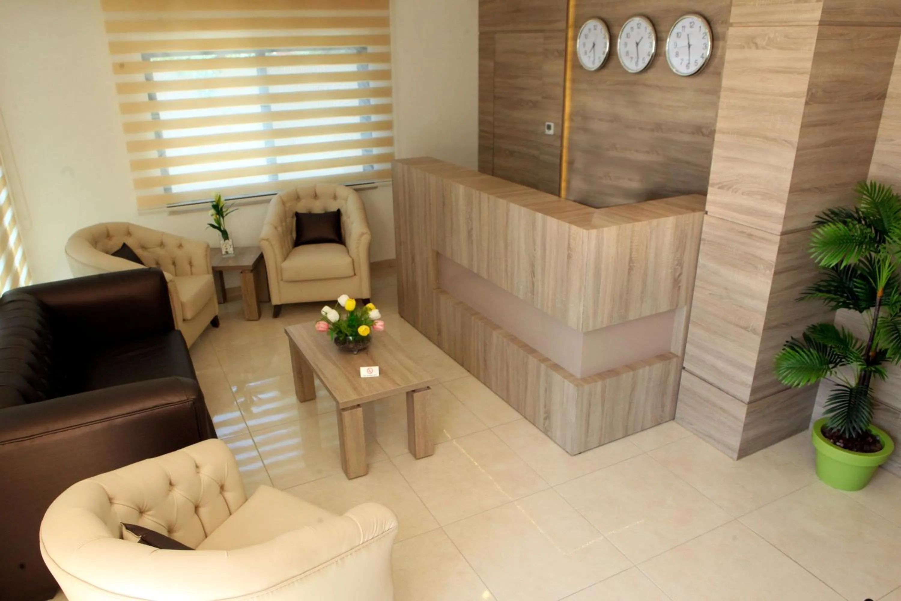 Lobby or reception in Almond Hotel Apartments