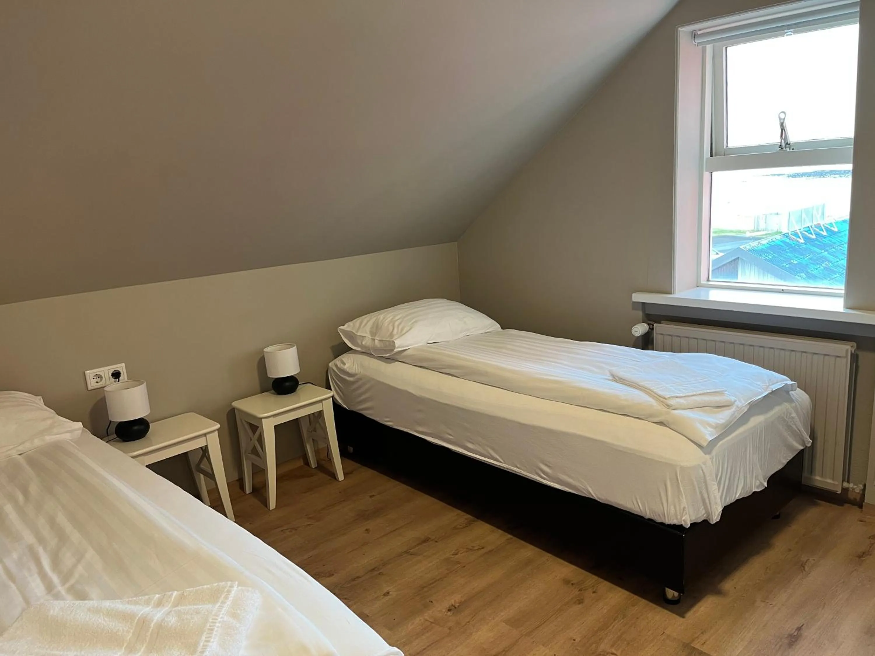 Bed in Guesthouse Hvammur by the Harbour