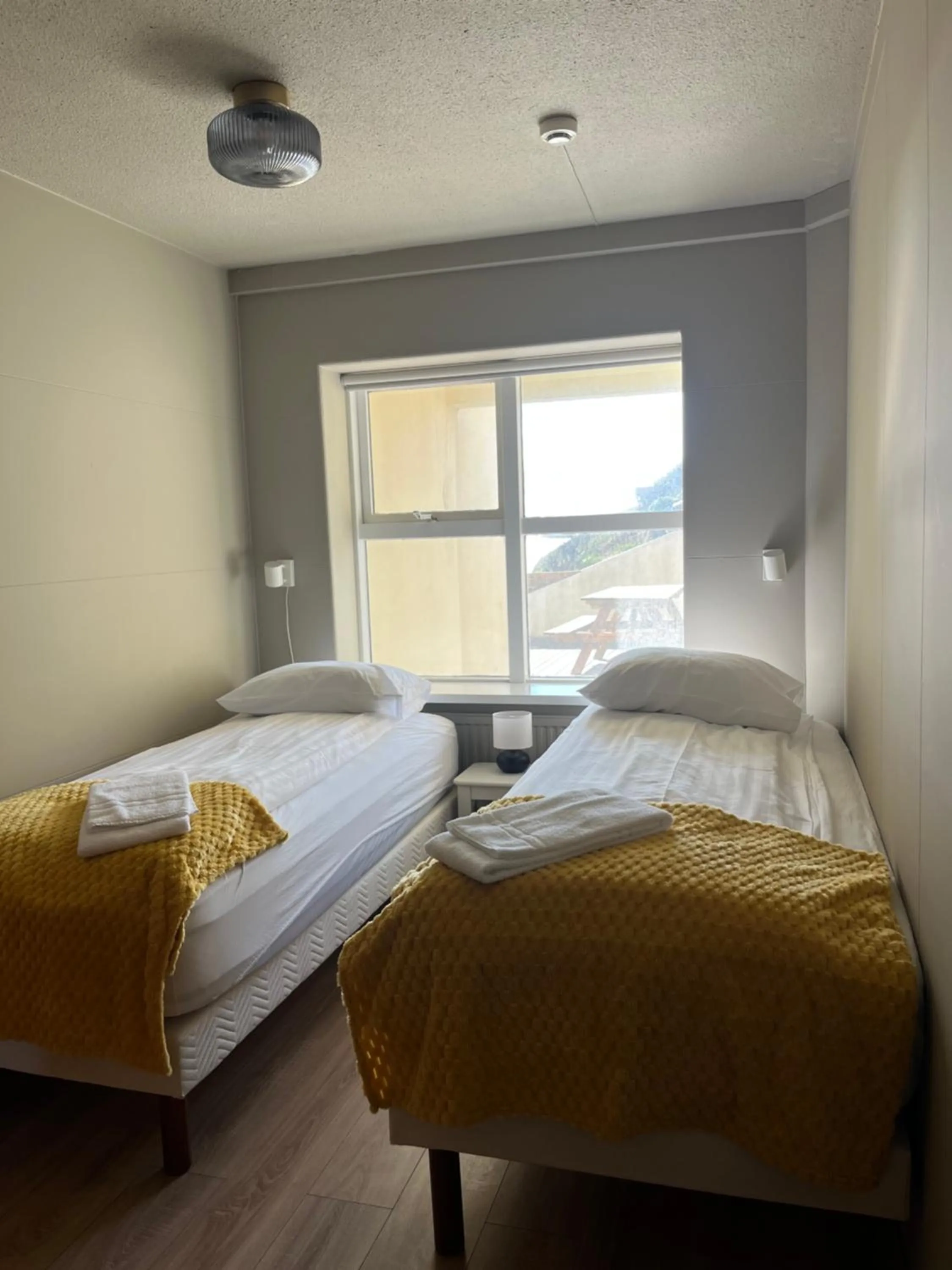 Bed in Guesthouse Hvammur by the Harbour