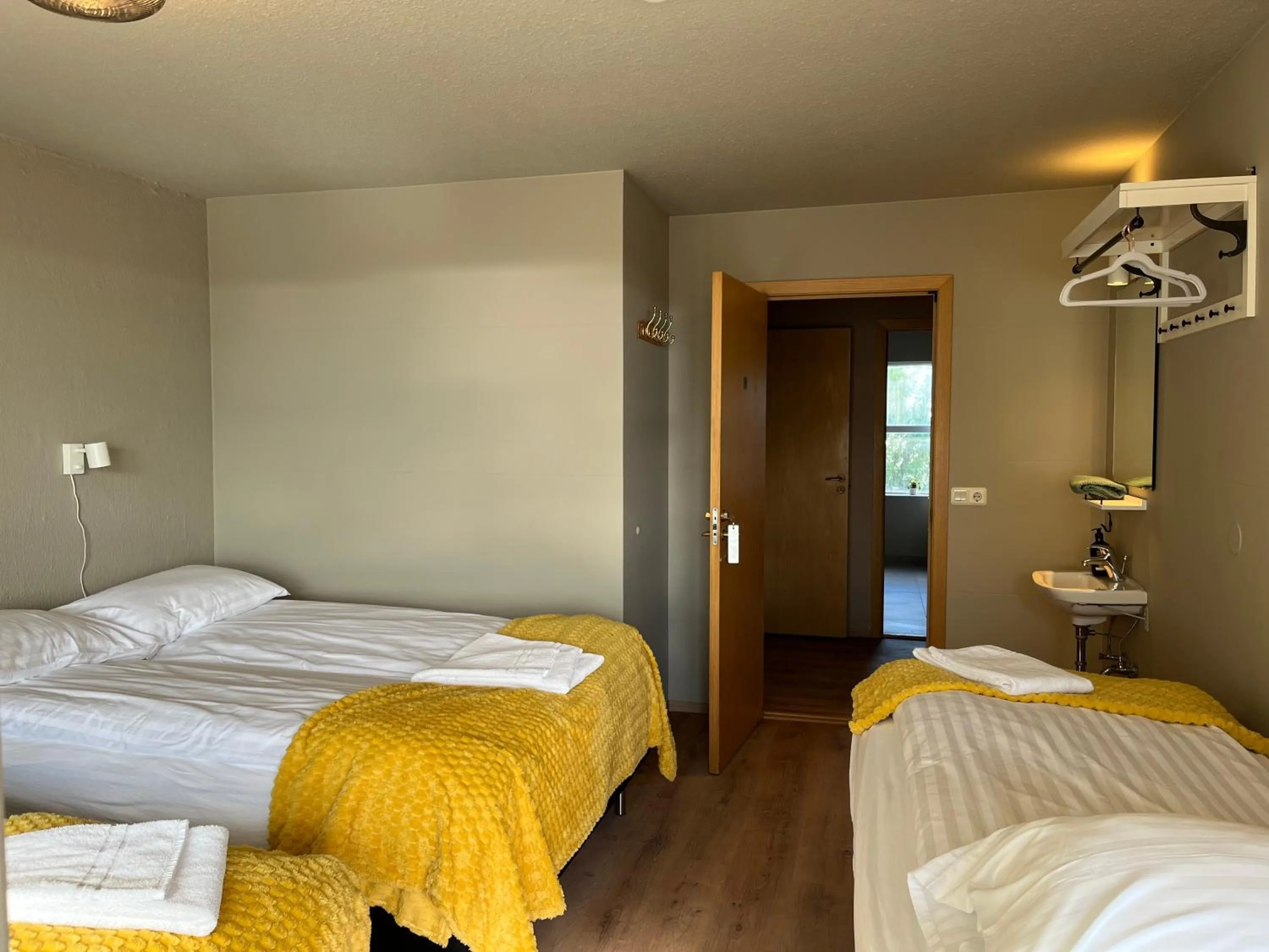 Bed in Guesthouse Hvammur by the Harbour